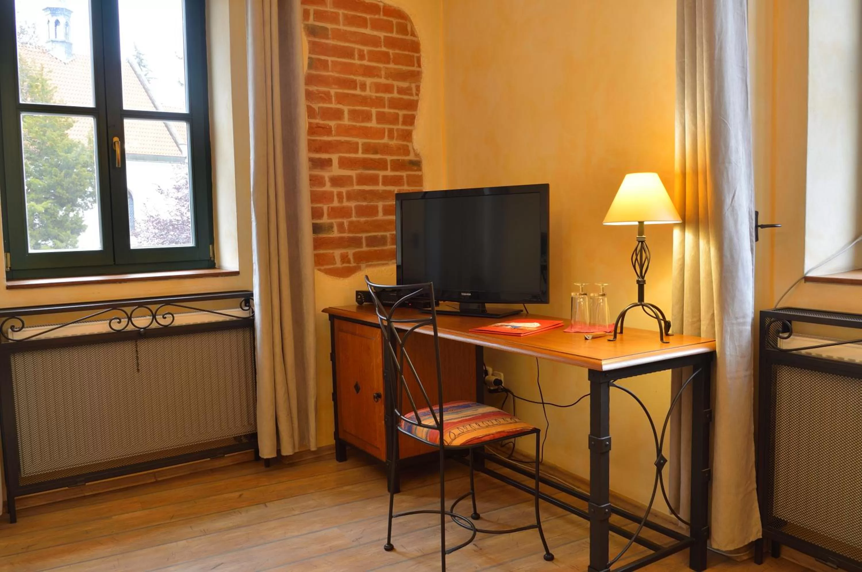 TV/Entertainment Center in Hotel and restaurant Via Ironia