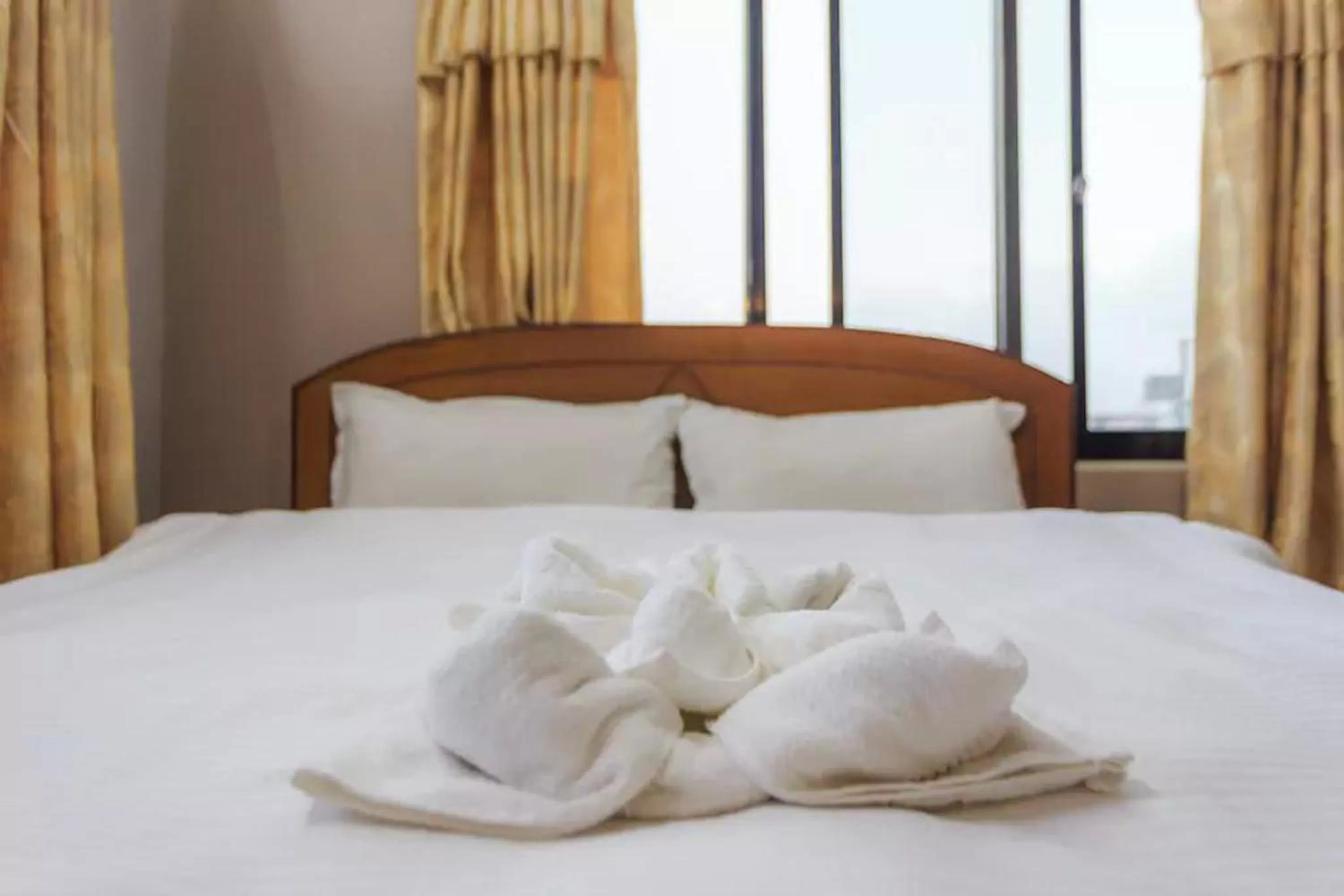 Bed in Hotel Immortal Inn