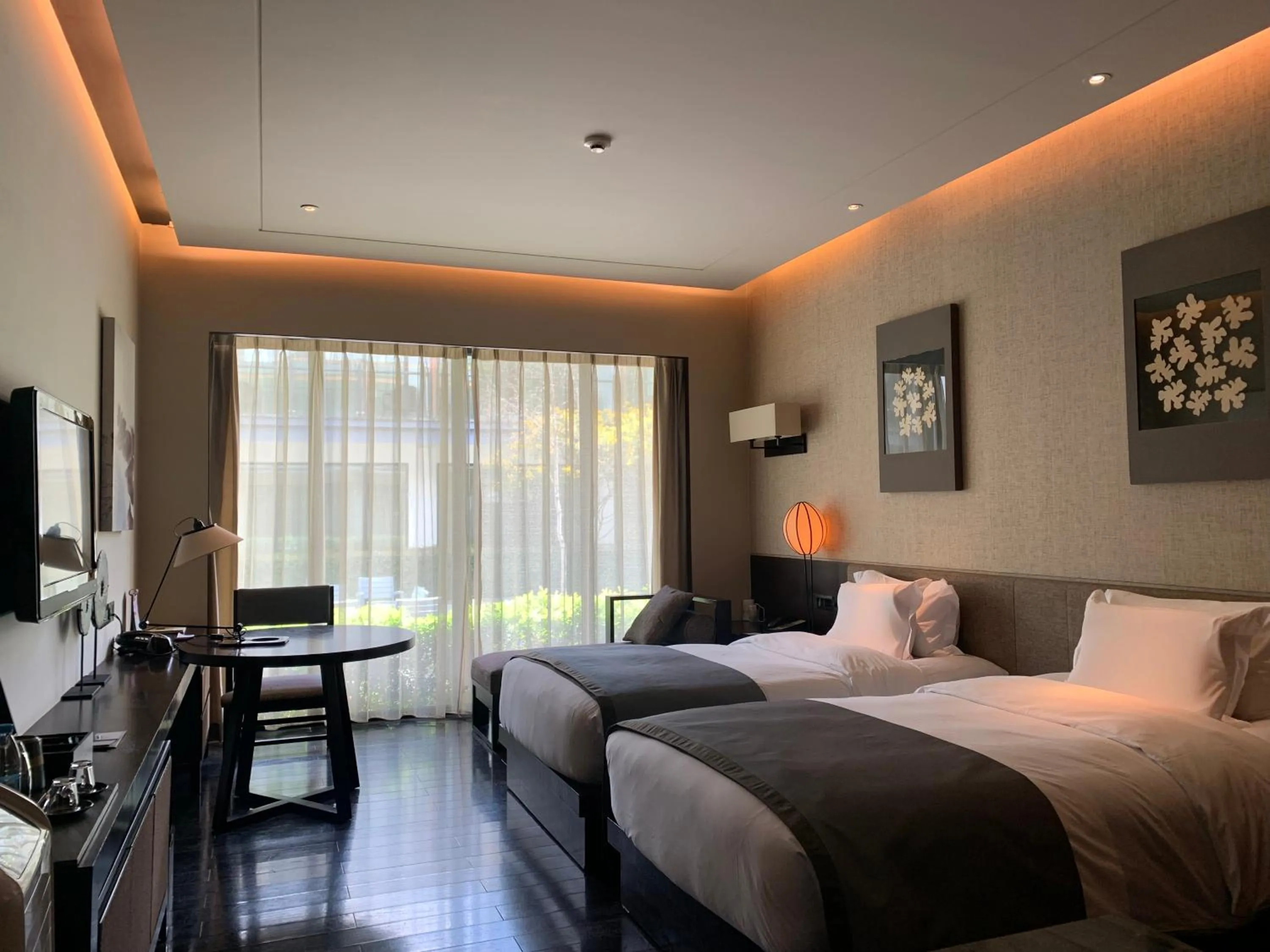 Bed in Pullman Lijiang Resort & Spa