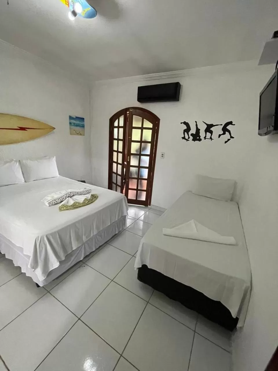 Bed in Pousada Praia do Tombo