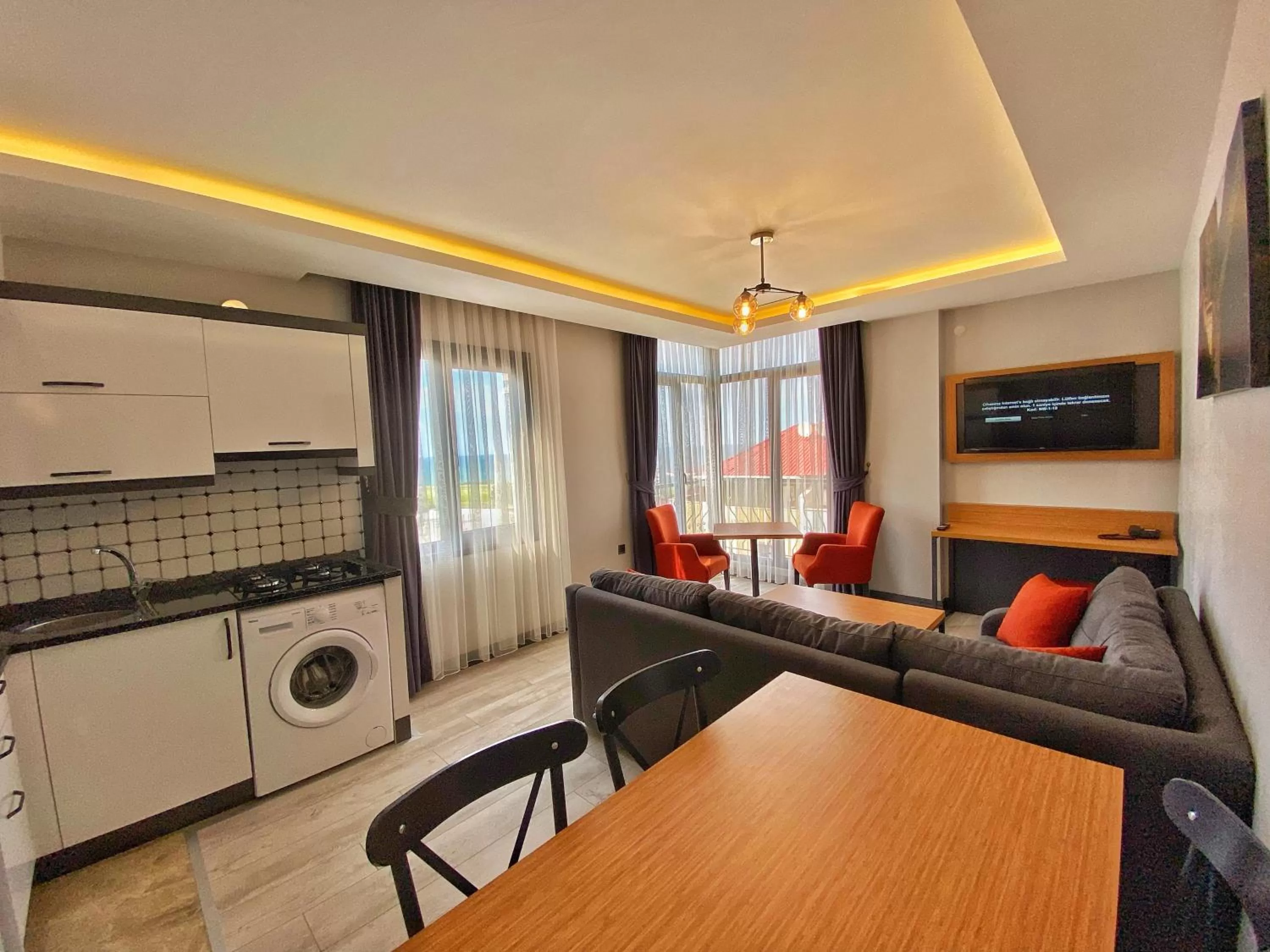 Living room, Kitchen/Kitchenette in My House Suite