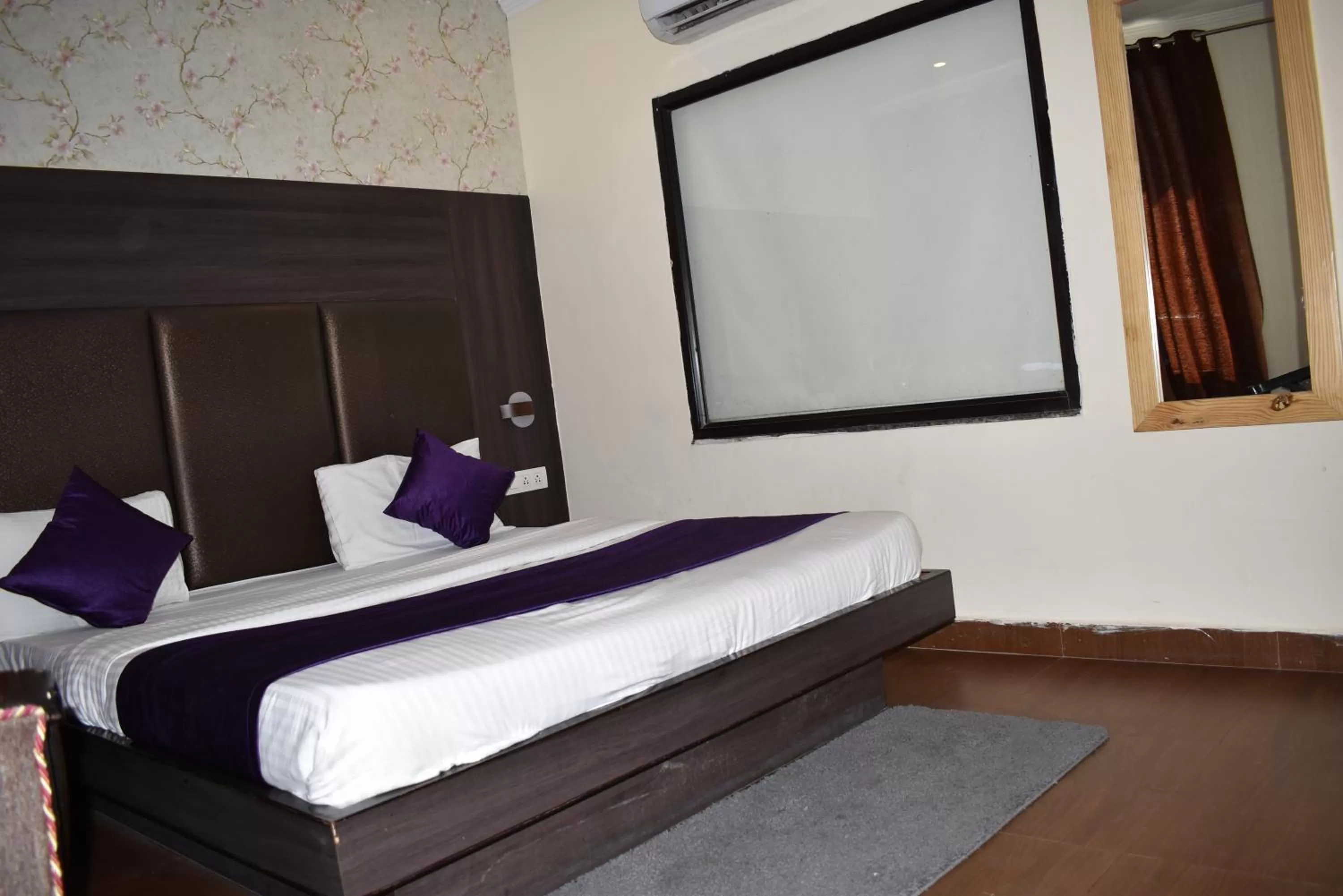 Bed in Tapasthali by Meera Hotels