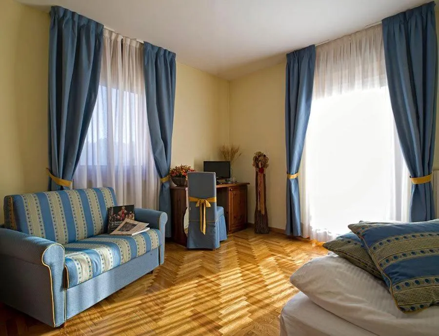 Bed in Hotel Belvedere Dolomiti