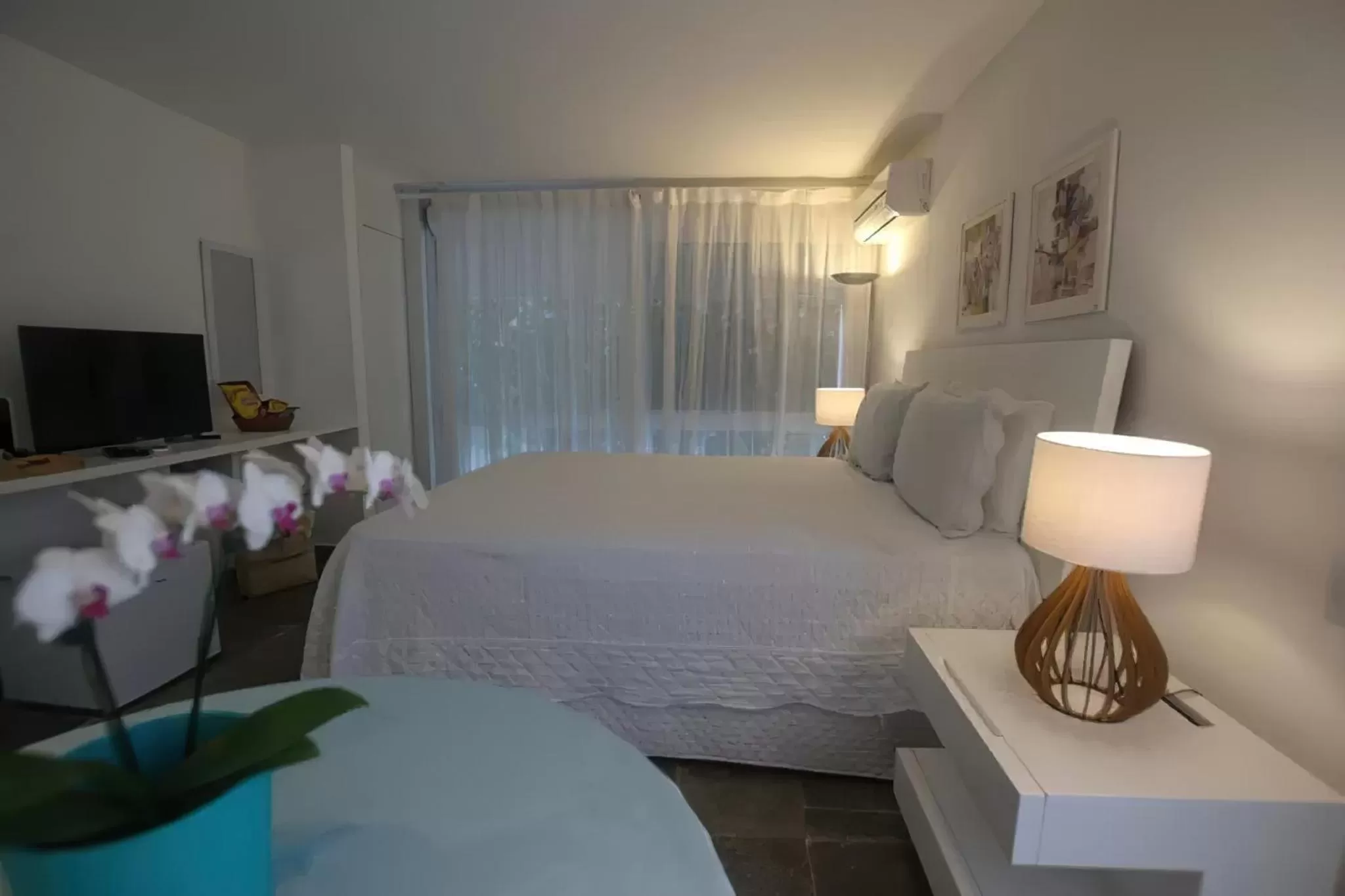 Bed in Guest House Guarujá