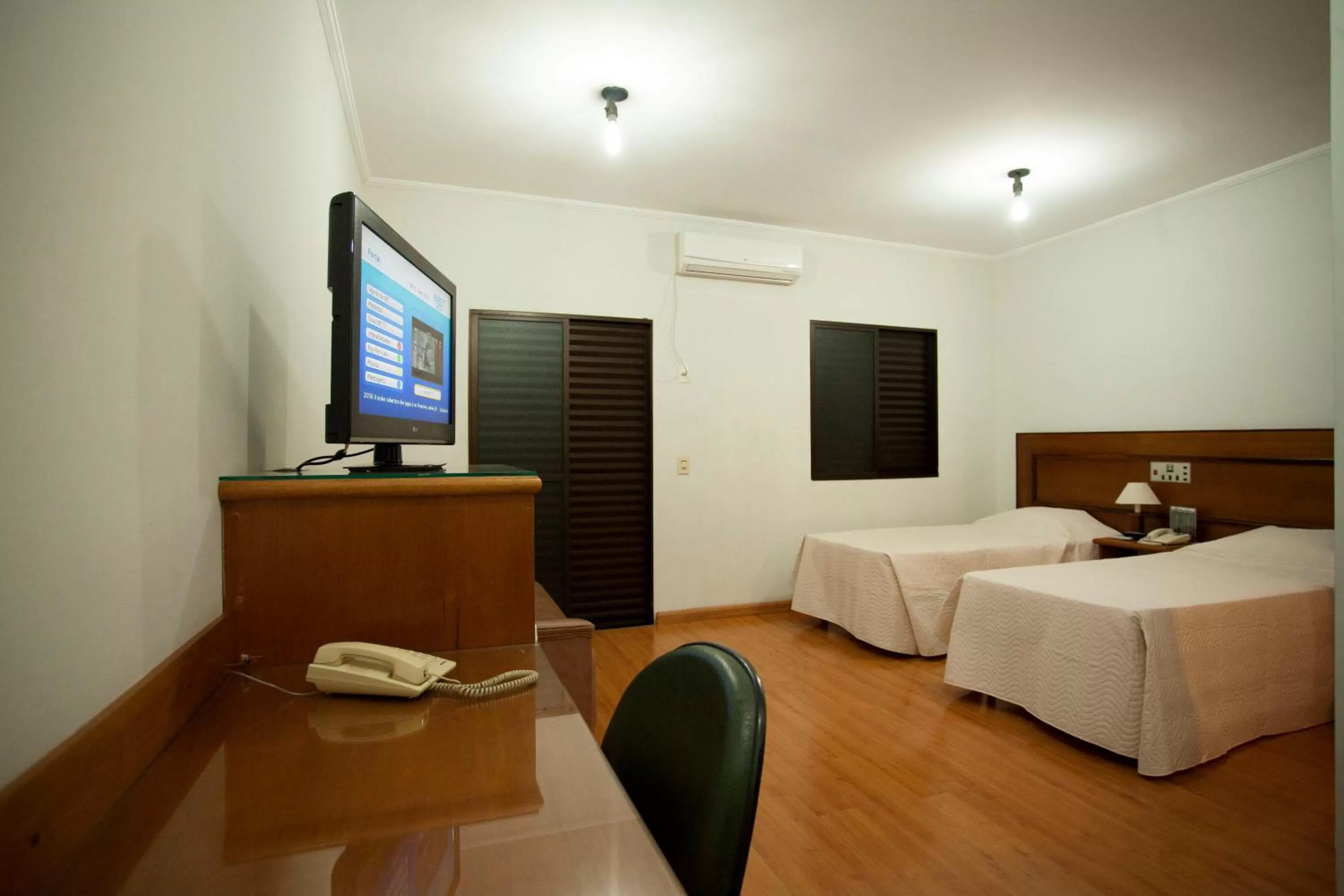 Photo of the whole room, TV/Entertainment Center in Indaiá Hotel Residence