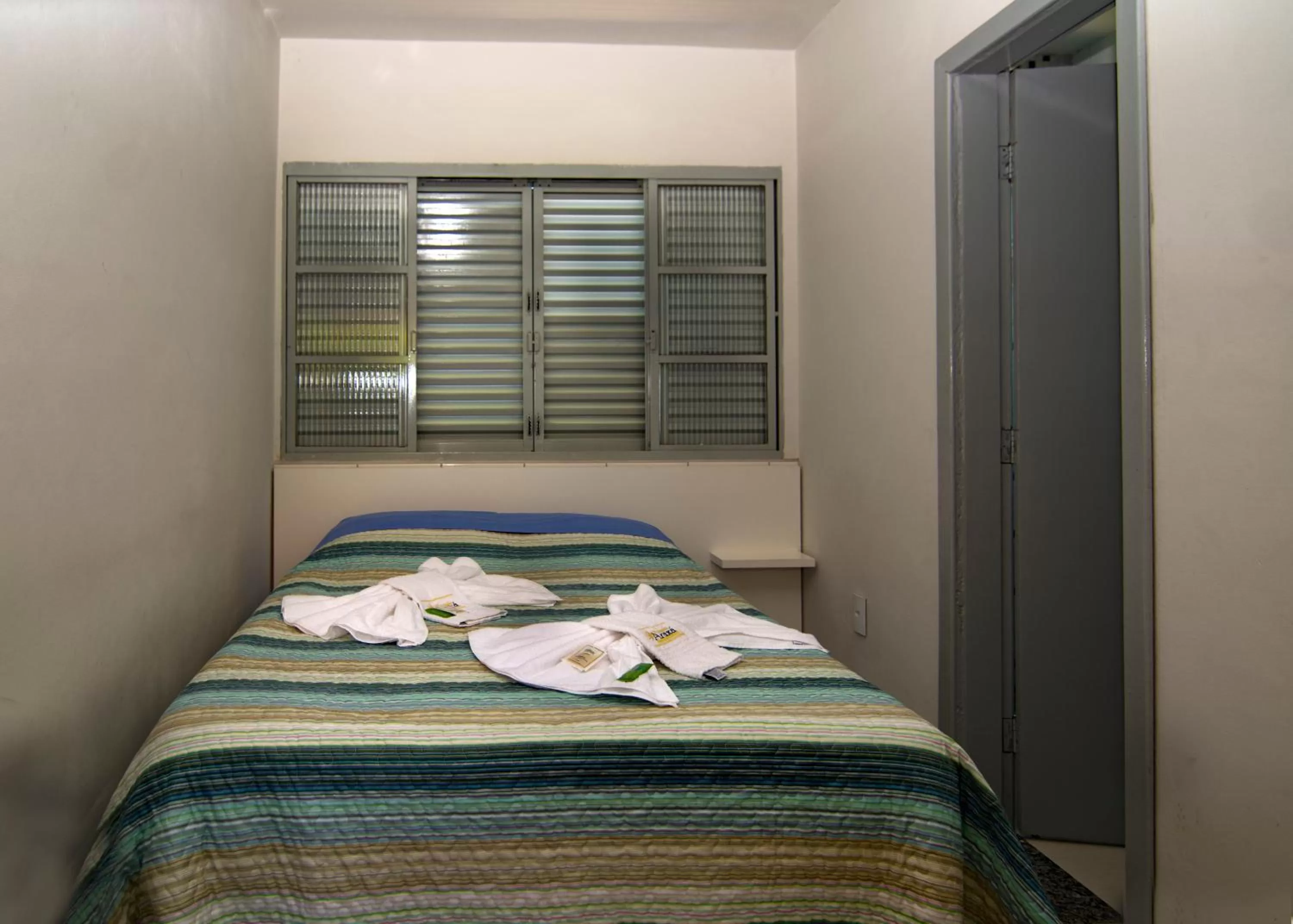 Bed in Pousada Araxá