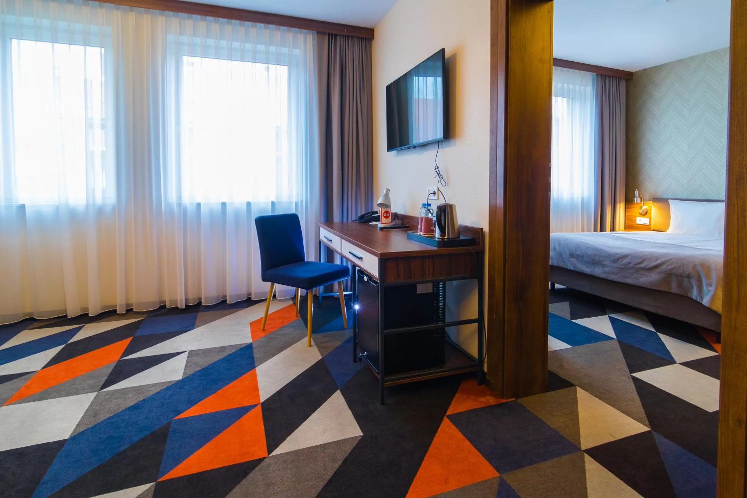 Living room, Bed in Vulcan Hotel