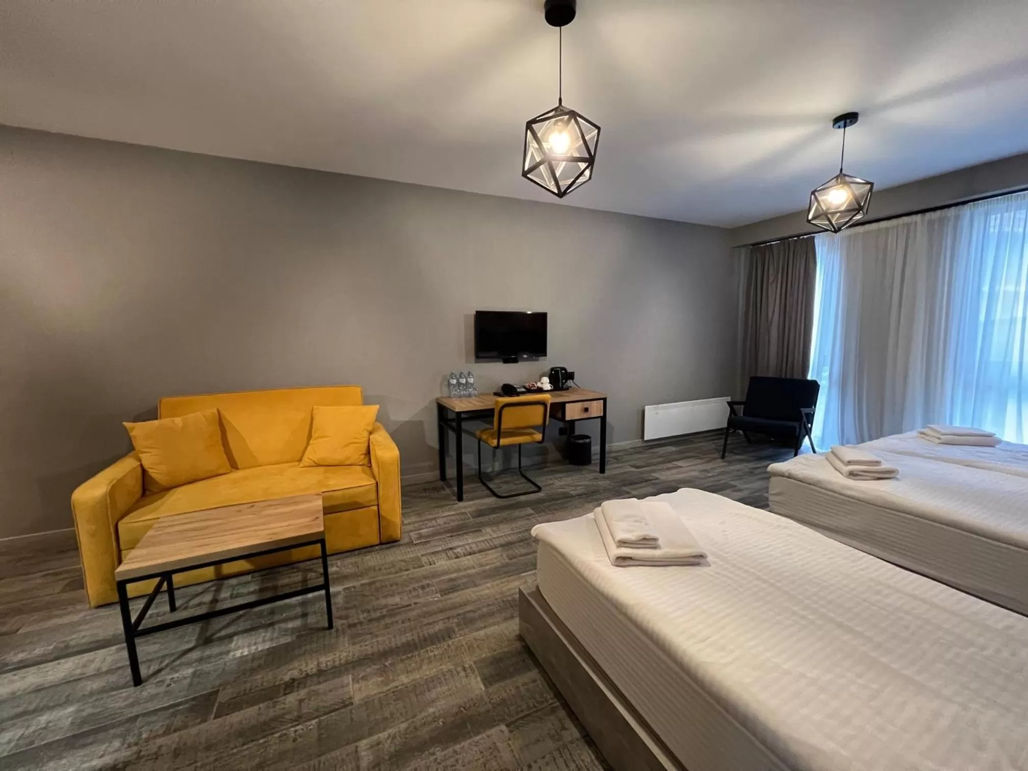 Seating area, Bed in Gudauri Loft Hotel