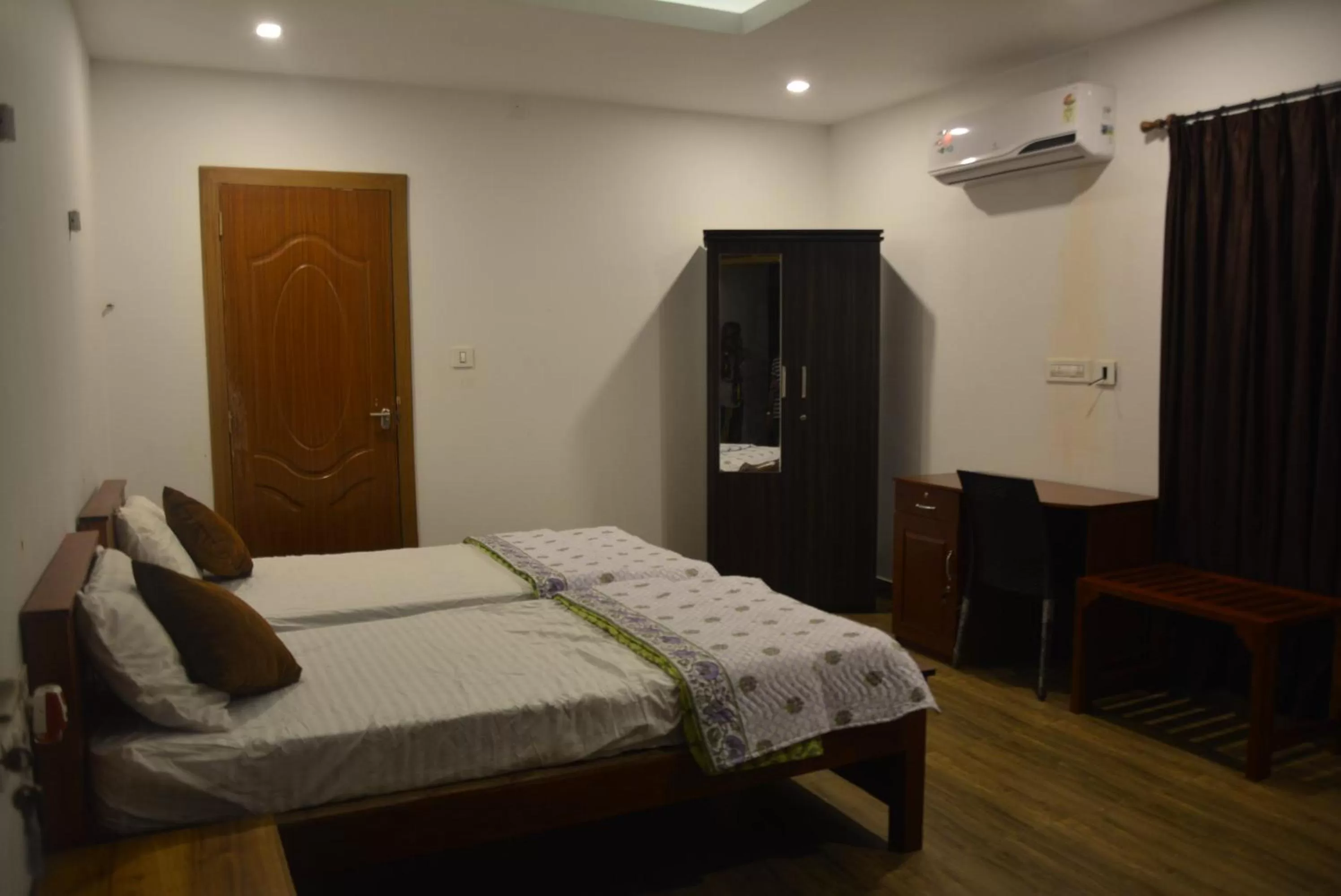 Bed in White Shell Beach House