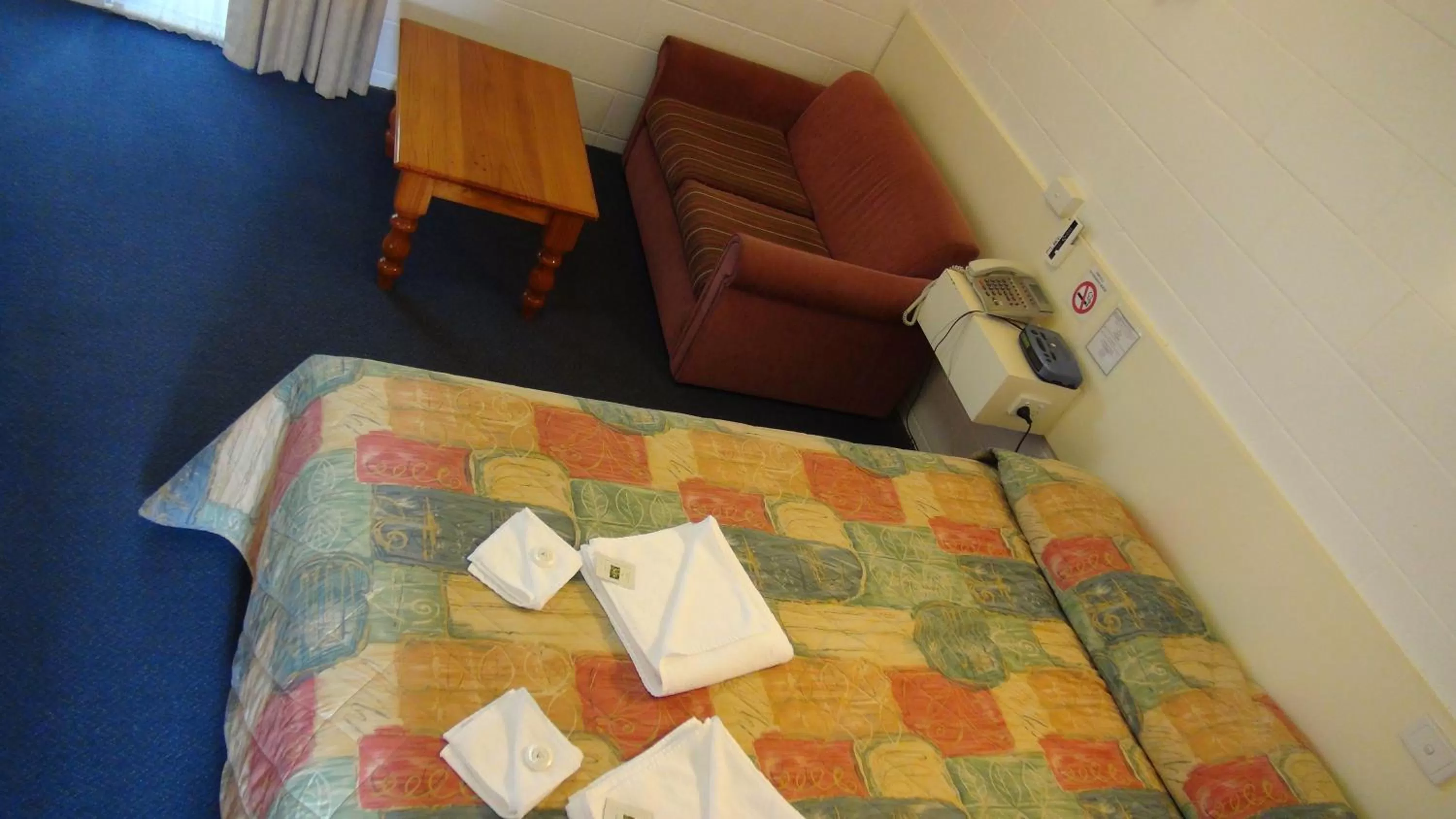 Bed in Pathfinder Motel