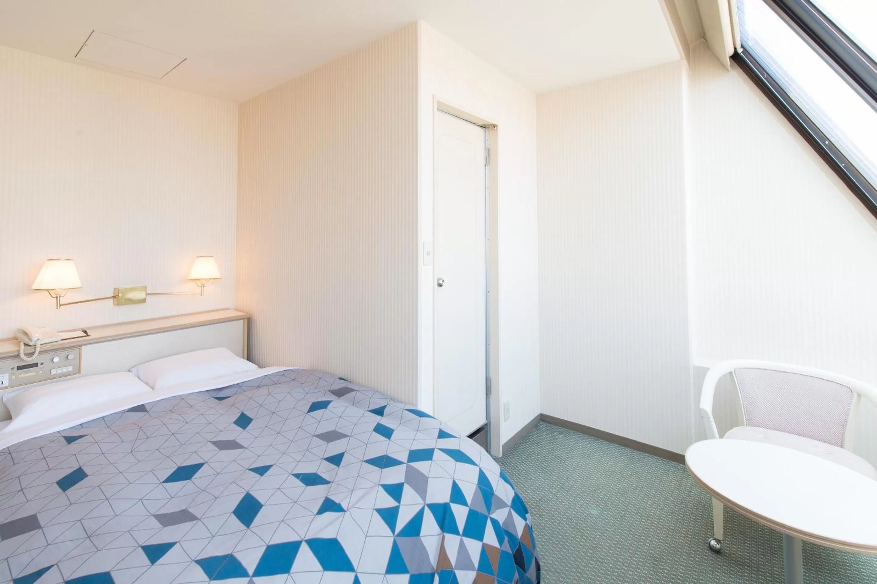 Photo of the whole room, Bed in Tabist Hotel Tetora Kitakyushu