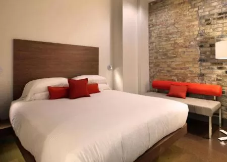 Bed in CityFlatsHotel - Grand Rapids, an Ascend Collection Hotel