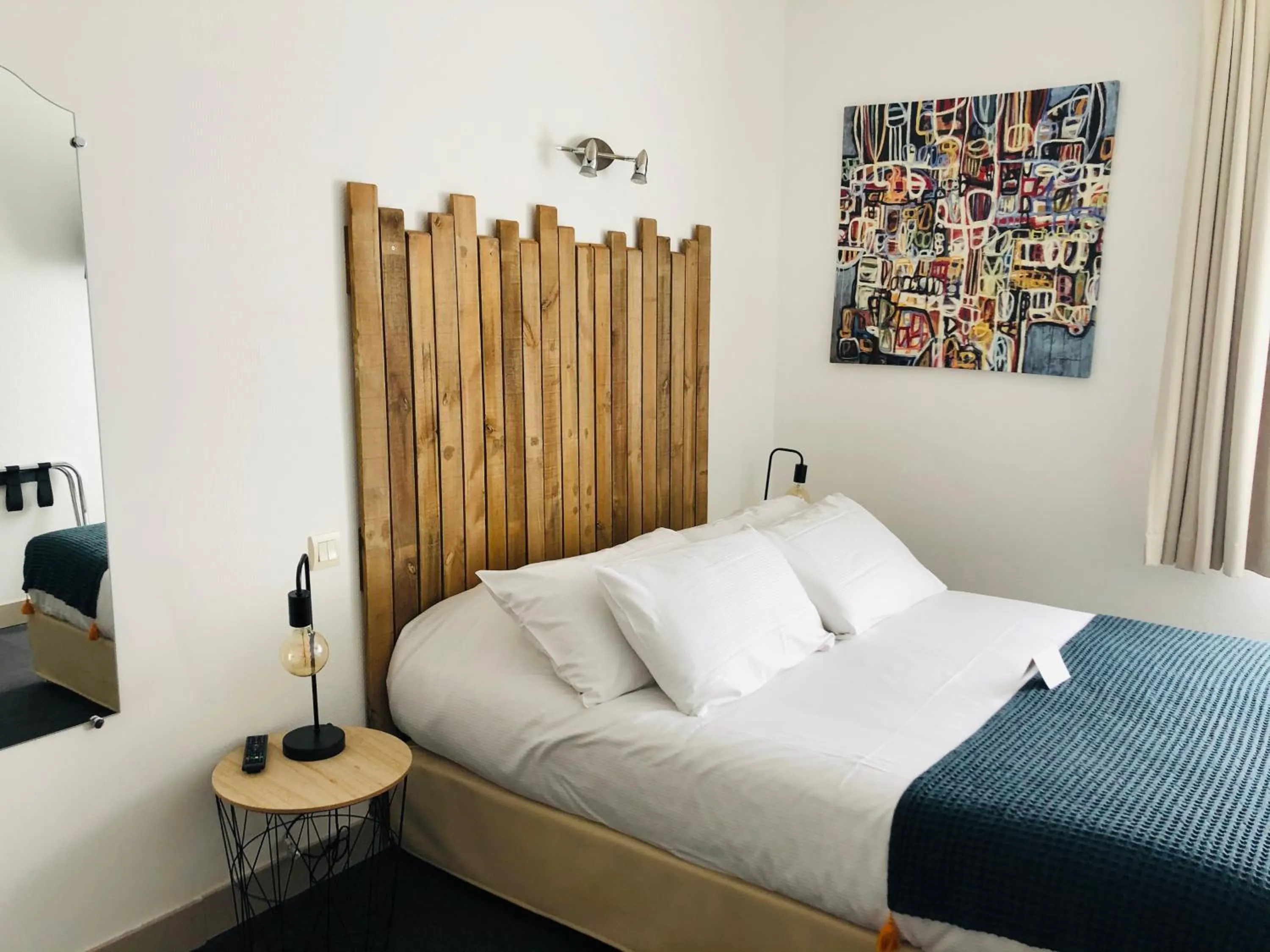 Bed in Logis Hôtel Sea View