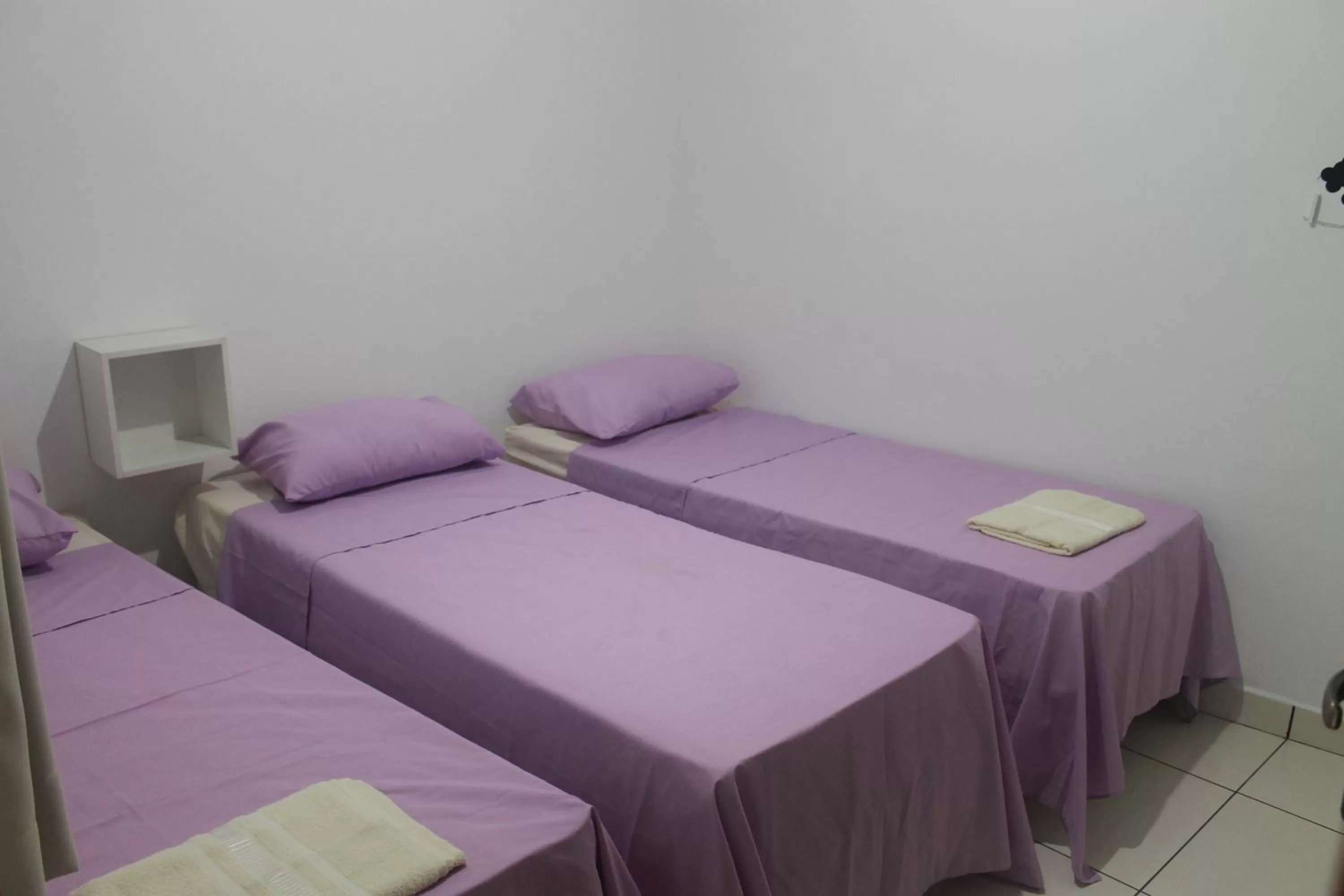 Bed in Pousada Orquideas de Maria