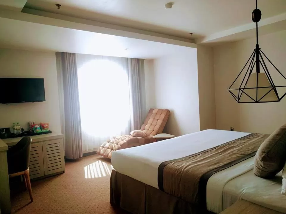 Bed in Holiday One Can Tho Hotel