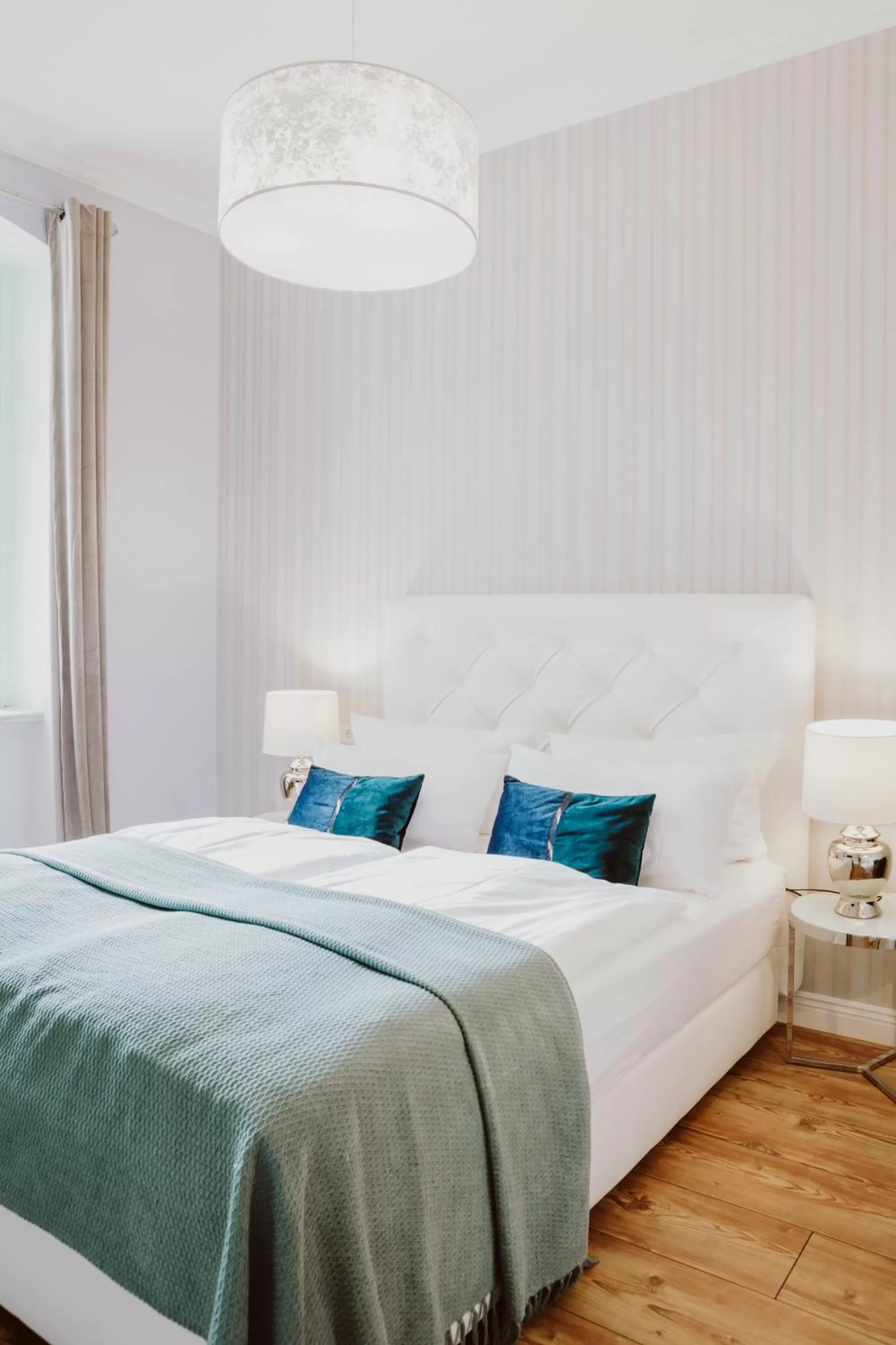 Bed in THE GATE GARDEN Hotel