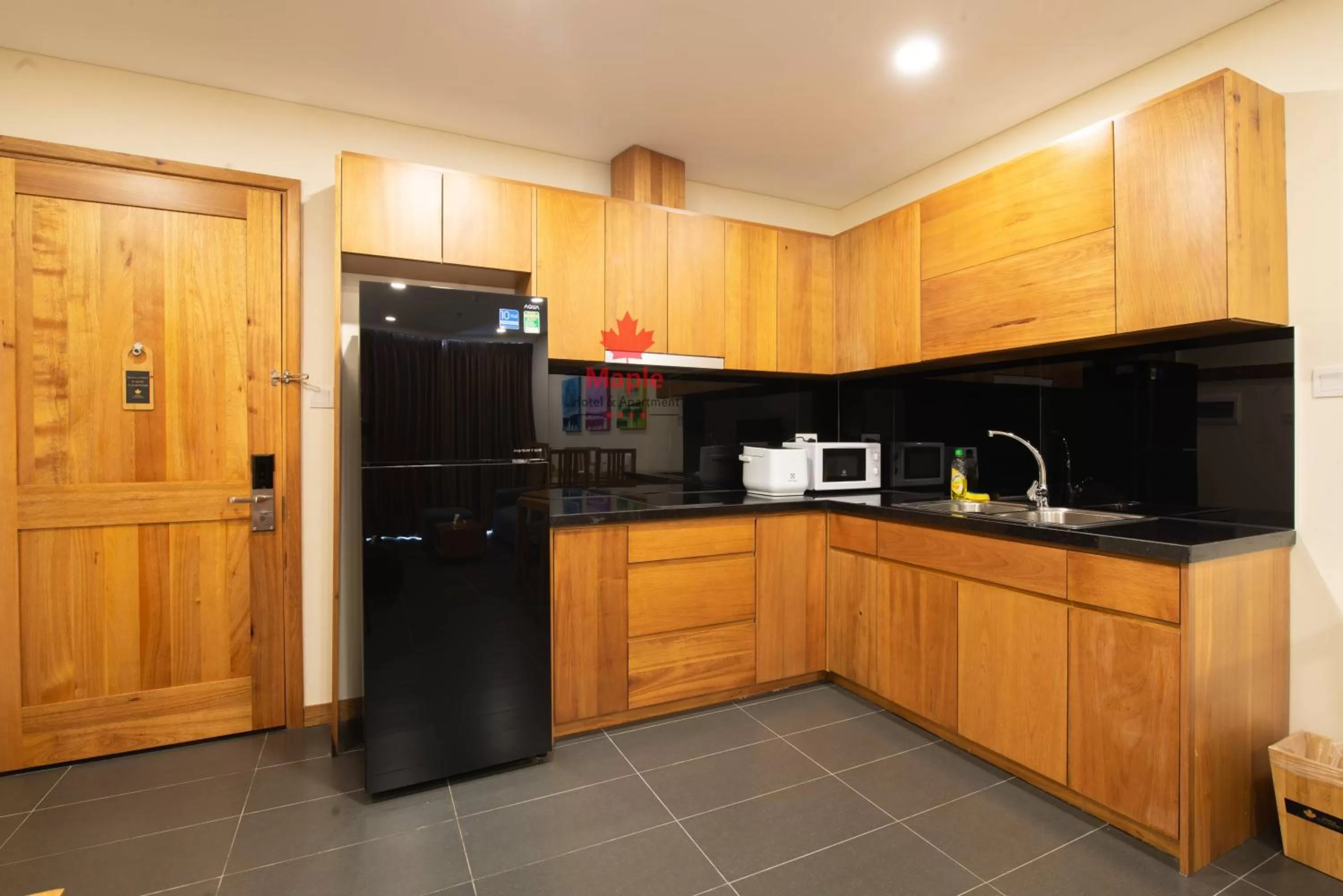 Kitchen or kitchenette in Maple Hotel & Apartment