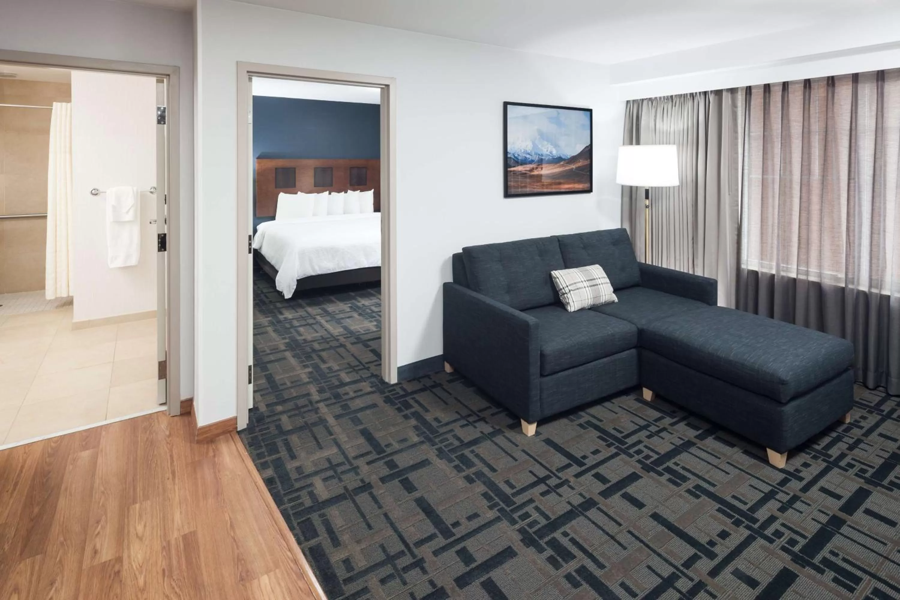 Living room, Bed in Embassy Suites Anchorage