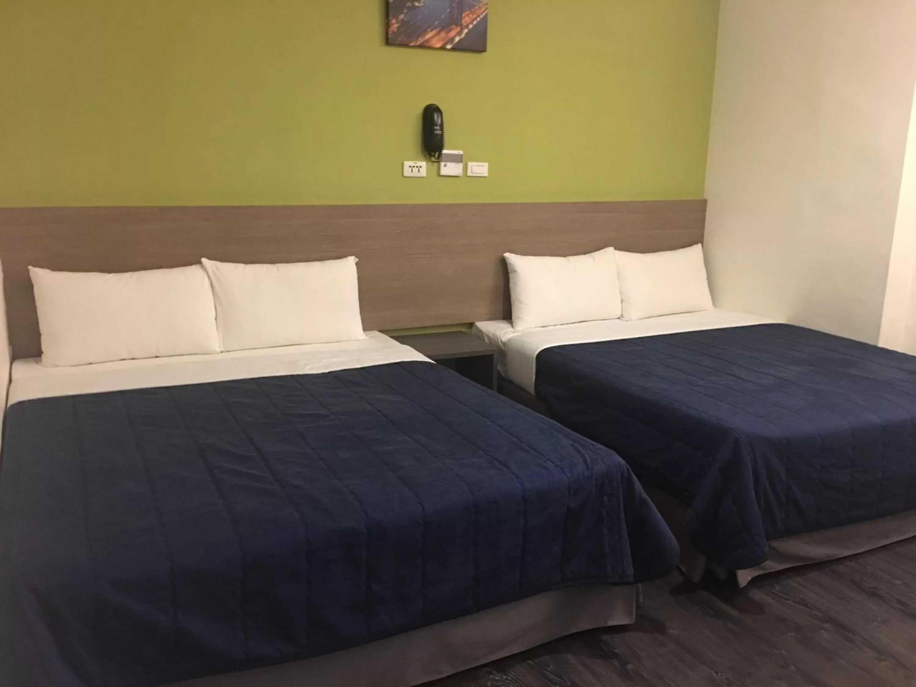 Bed in Bulowan Hotel