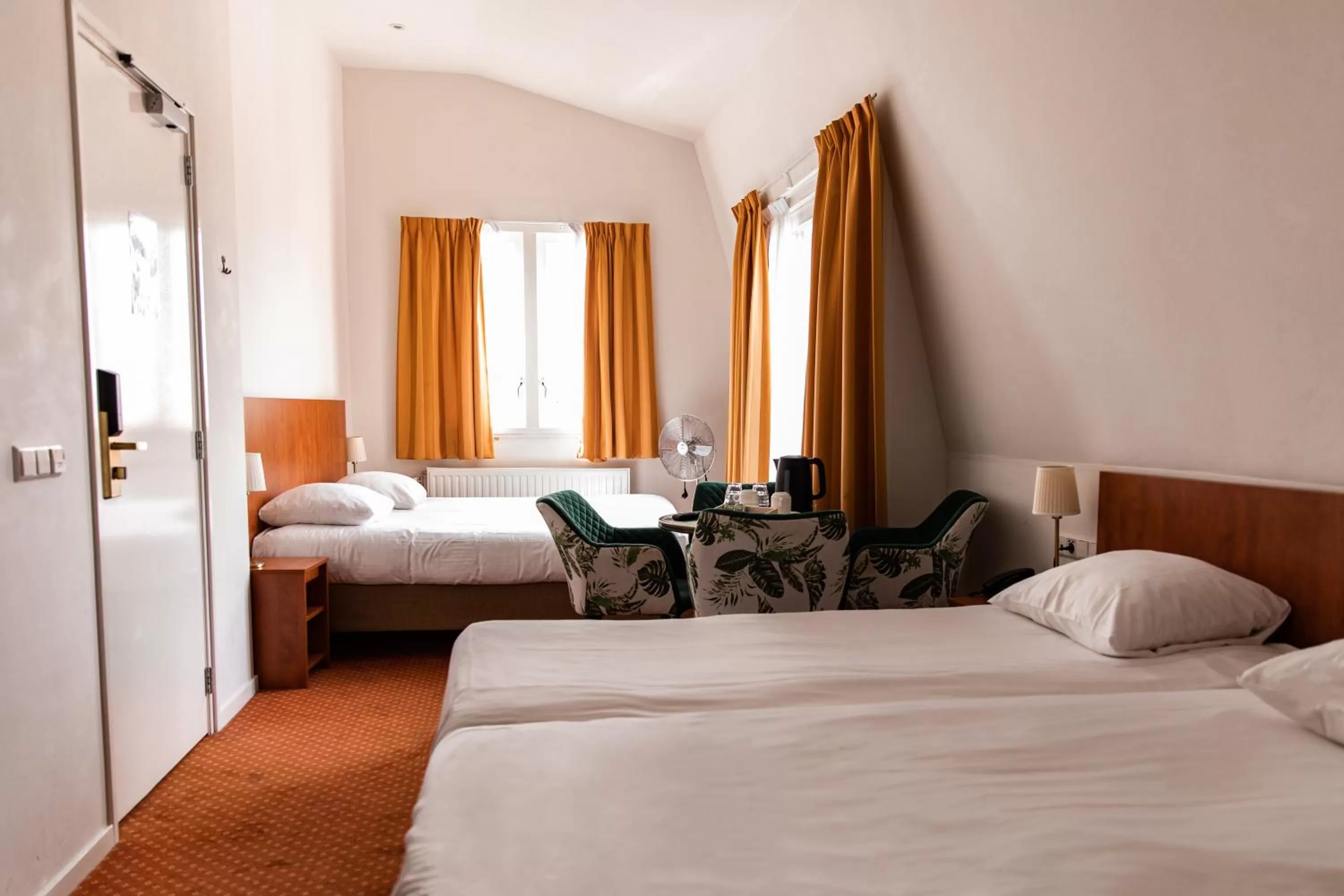 Bed in Ambassador City Centre Hotel