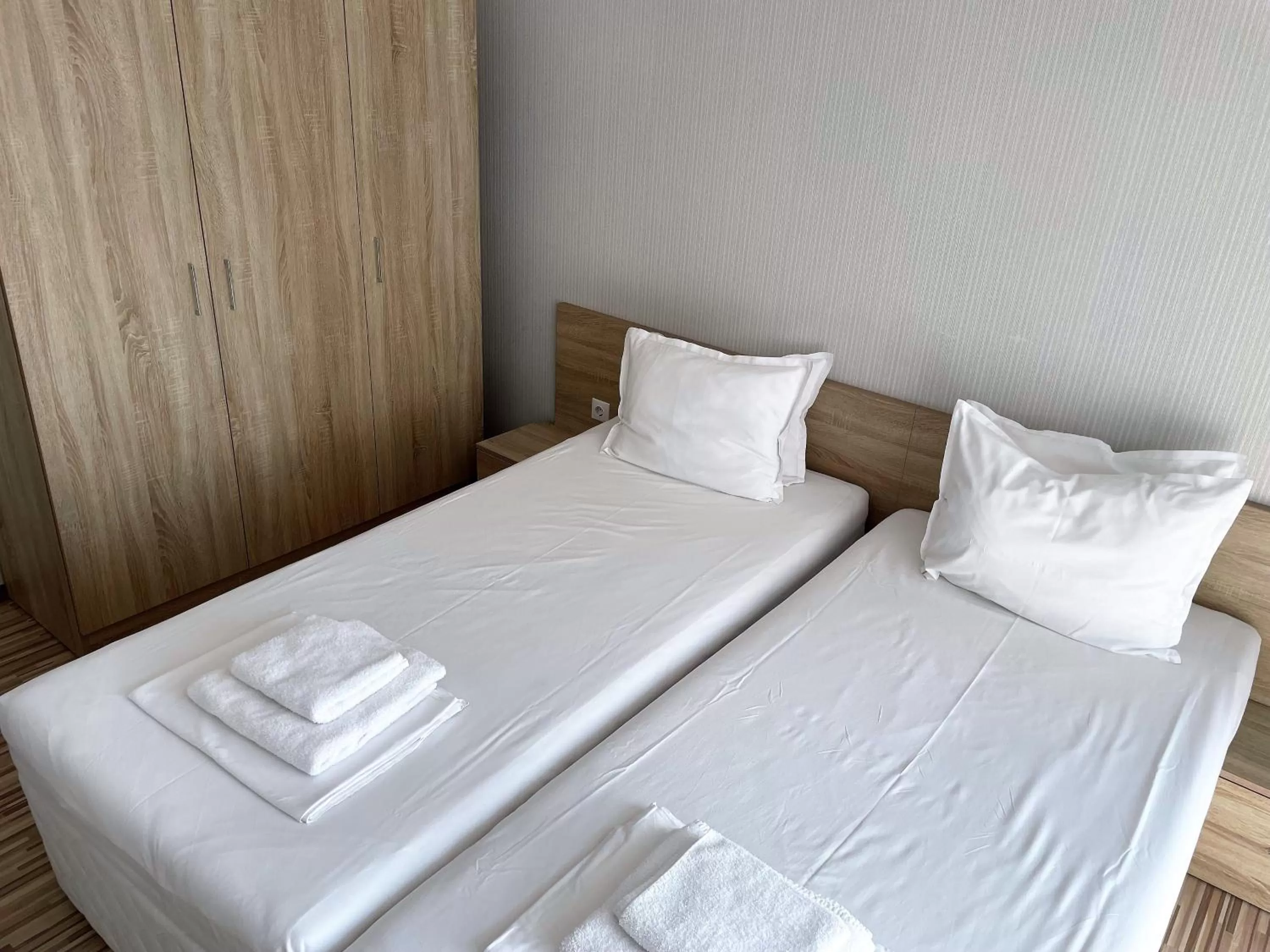 Bed in APART-HOTEL Stamopolu Lux с изглед към морето