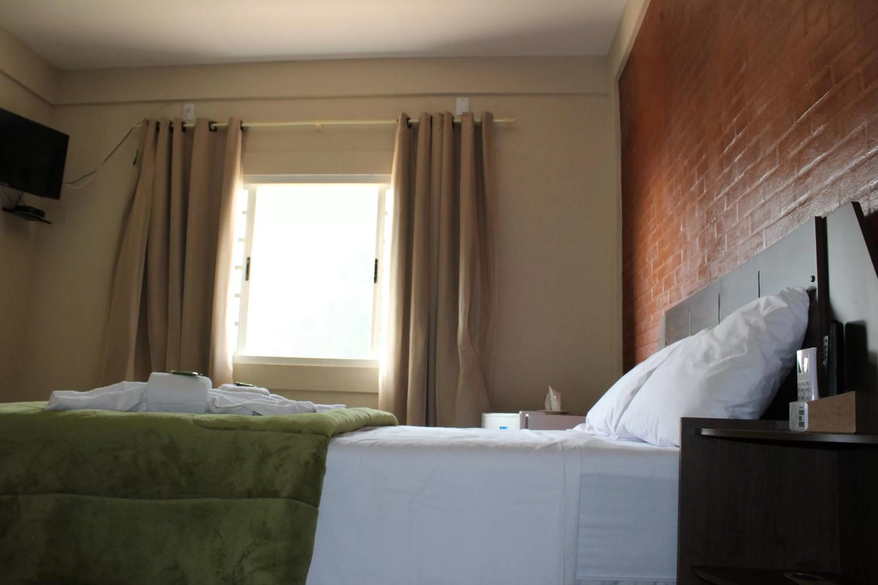 Bed in Pousada Morro dos Ventos