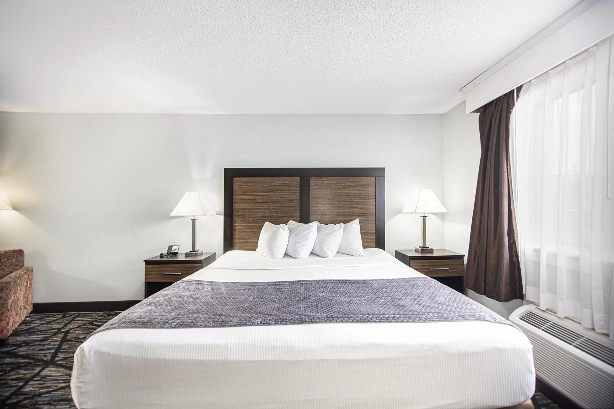 Bed in Baymont by Wyndham Grand Haven