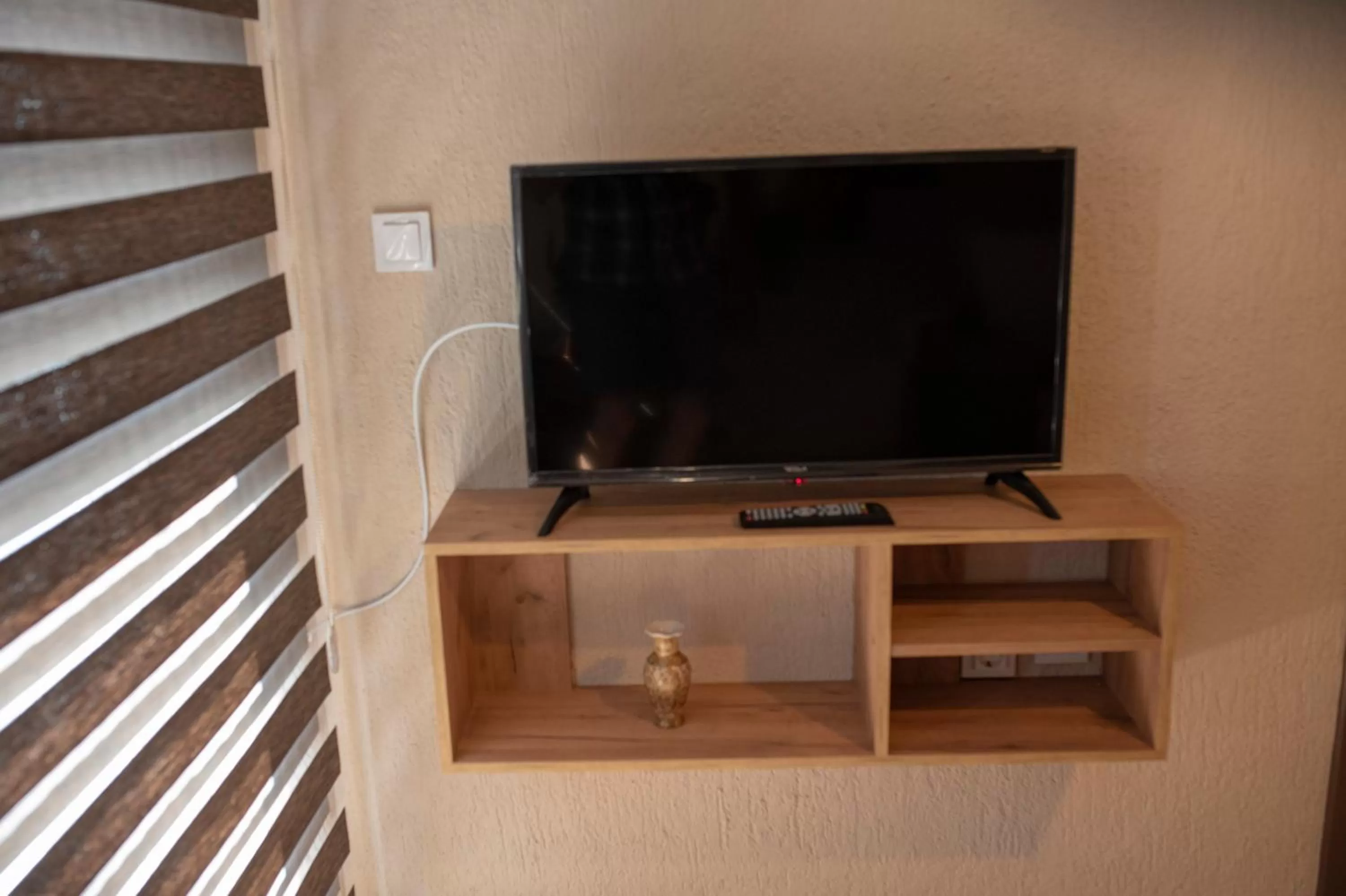 TV/Entertainment Center in DIONIS Rooms & Apartments