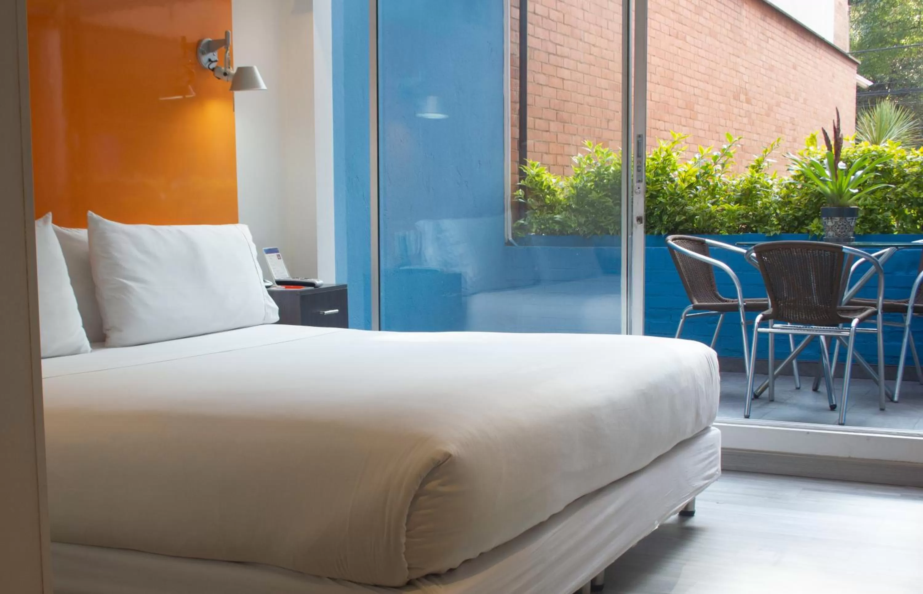 Bed in Hotel 104 Art Suites