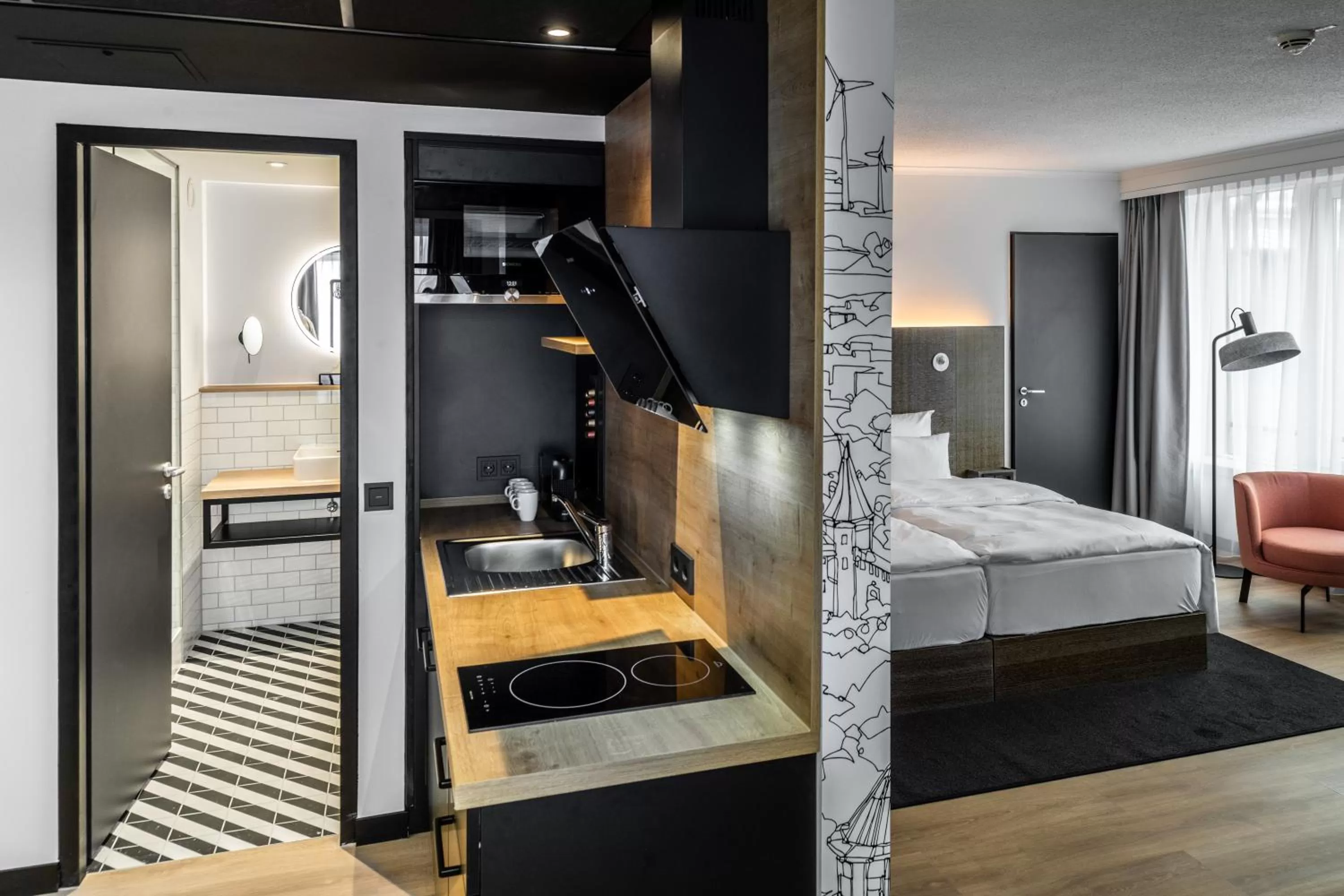 Kitchen or kitchenette, Bed in Pentahotel Rostock