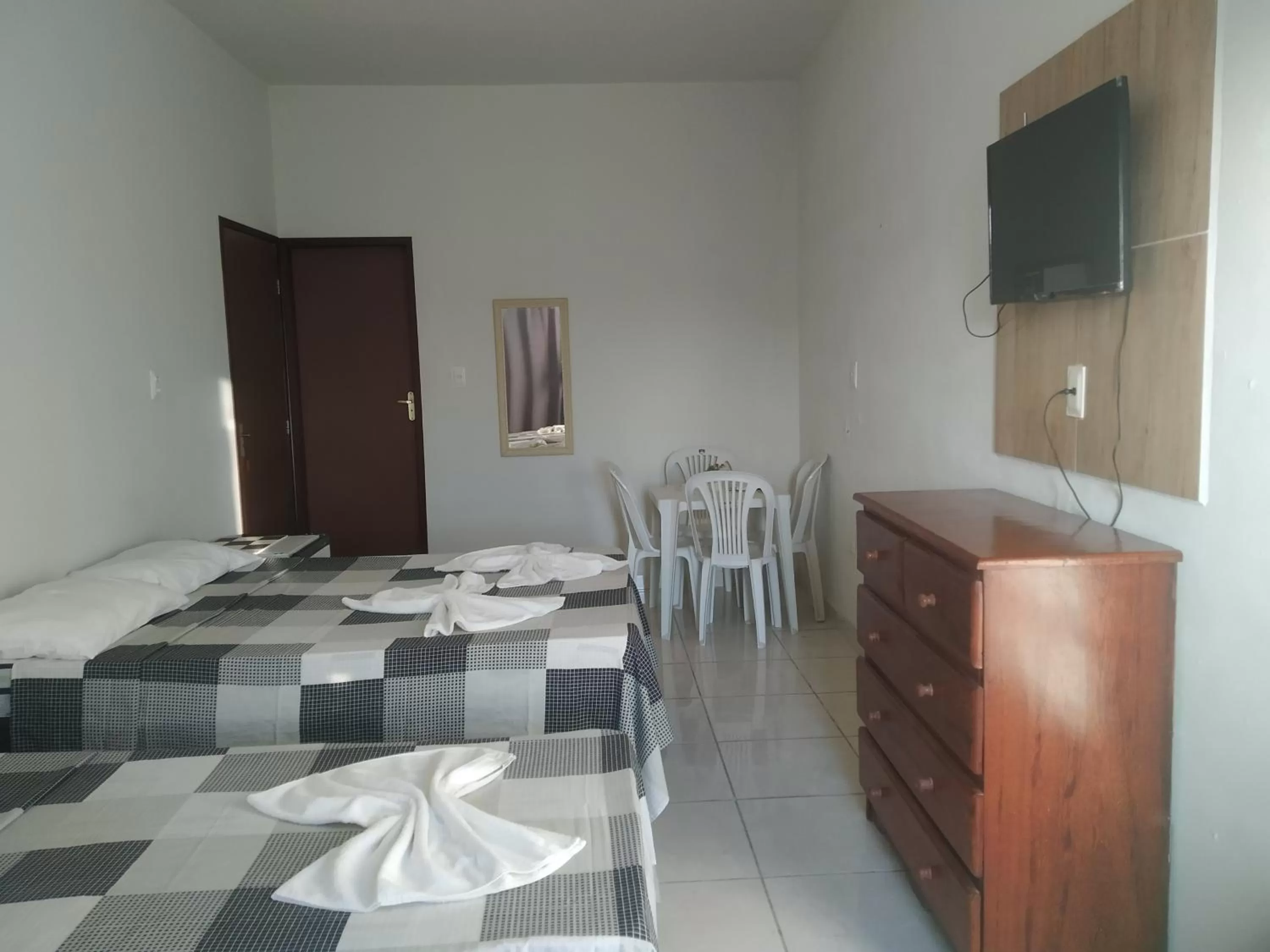 Bedroom, TV/Entertainment Center in Pousada Recanto Canaã