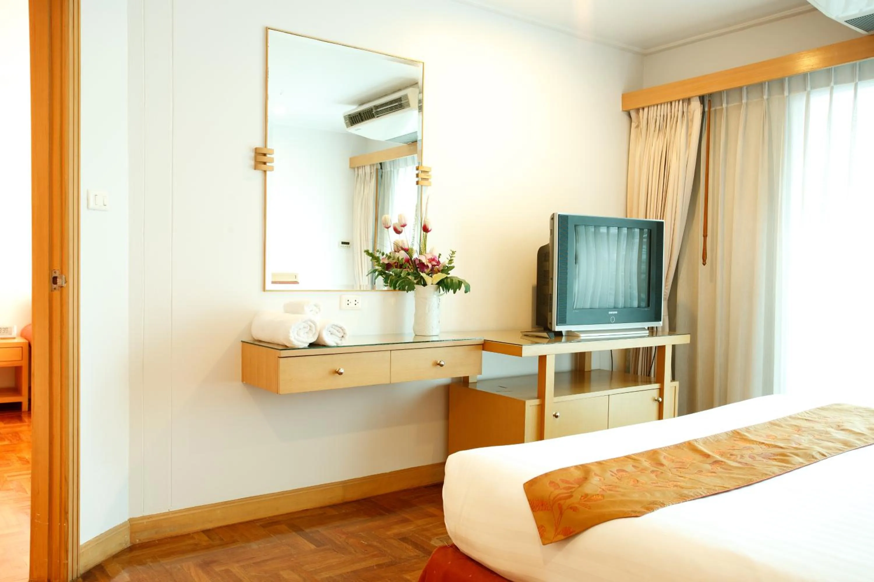 Bed in Chaidee Mansion