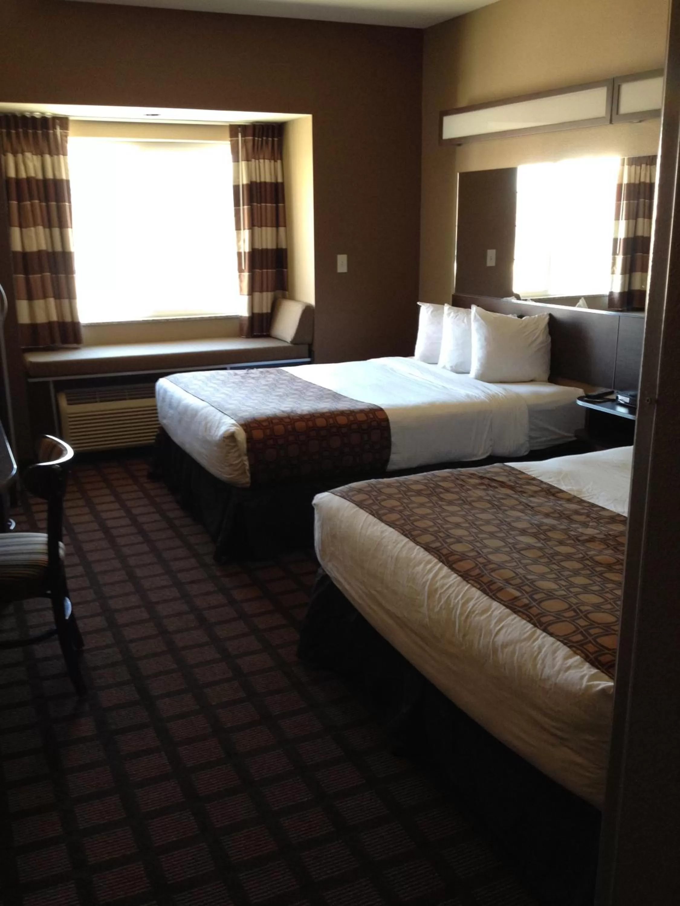 Bed in Microtel Inn & Suites