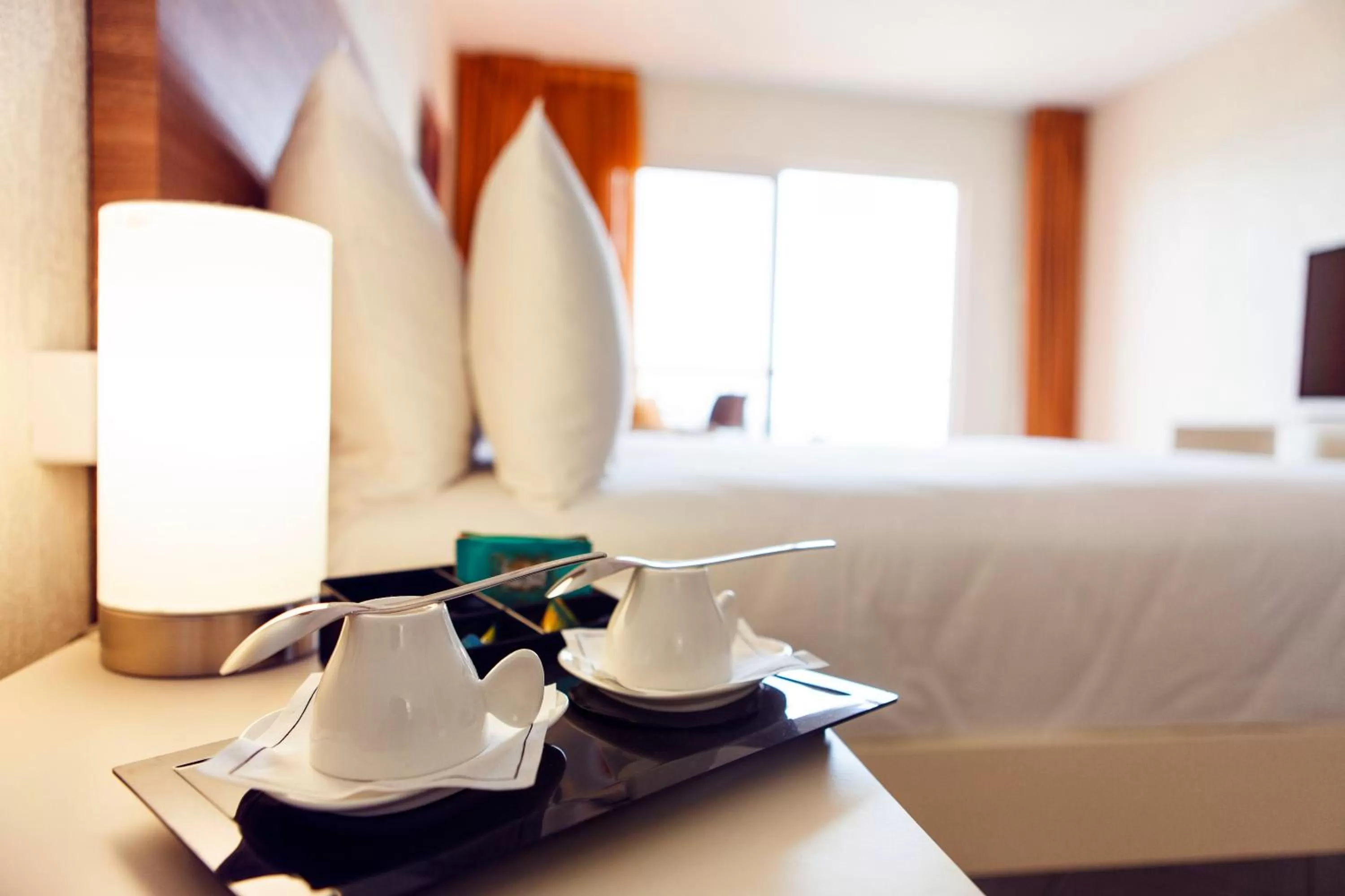 Bed in Hotel Arawak Beach Resort