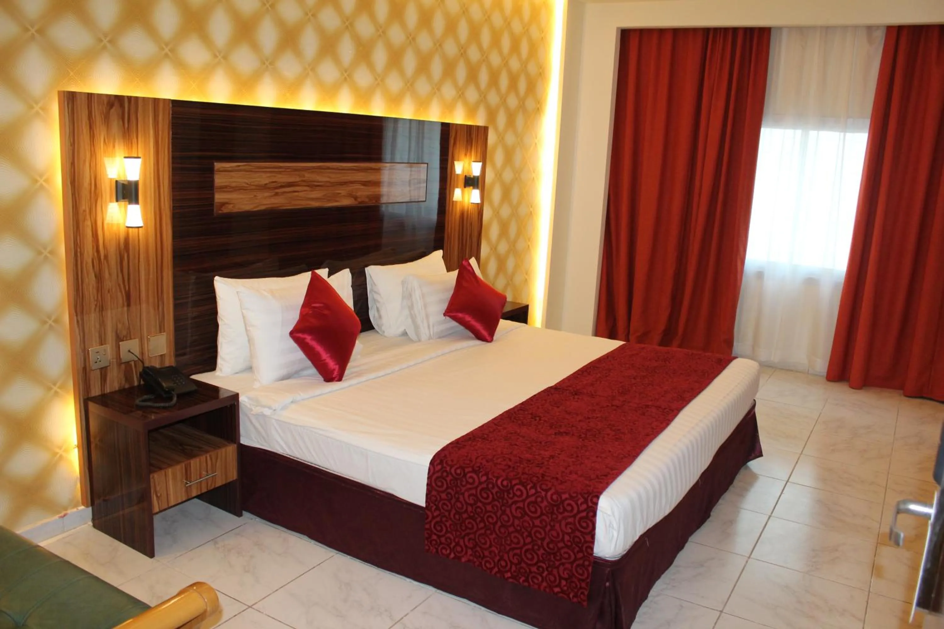 Bed in Grand Nova Hotel