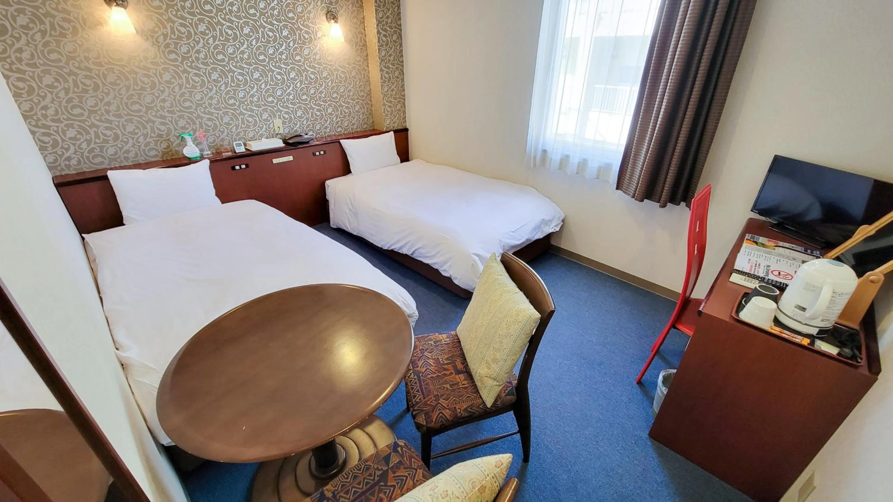 Bed in Hotel Palms Tenmonkan