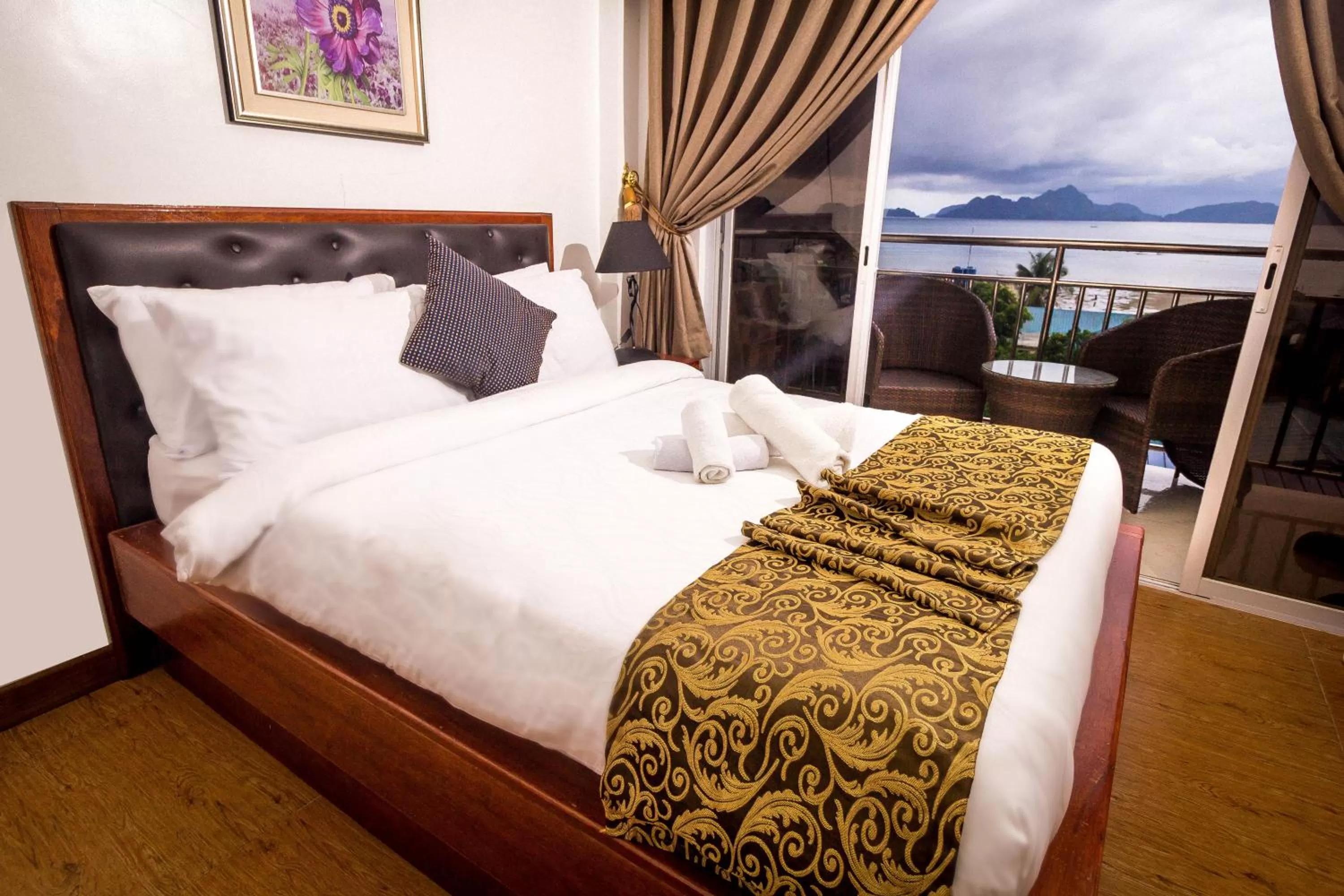 Bed in El Nido Royal Palm Inn