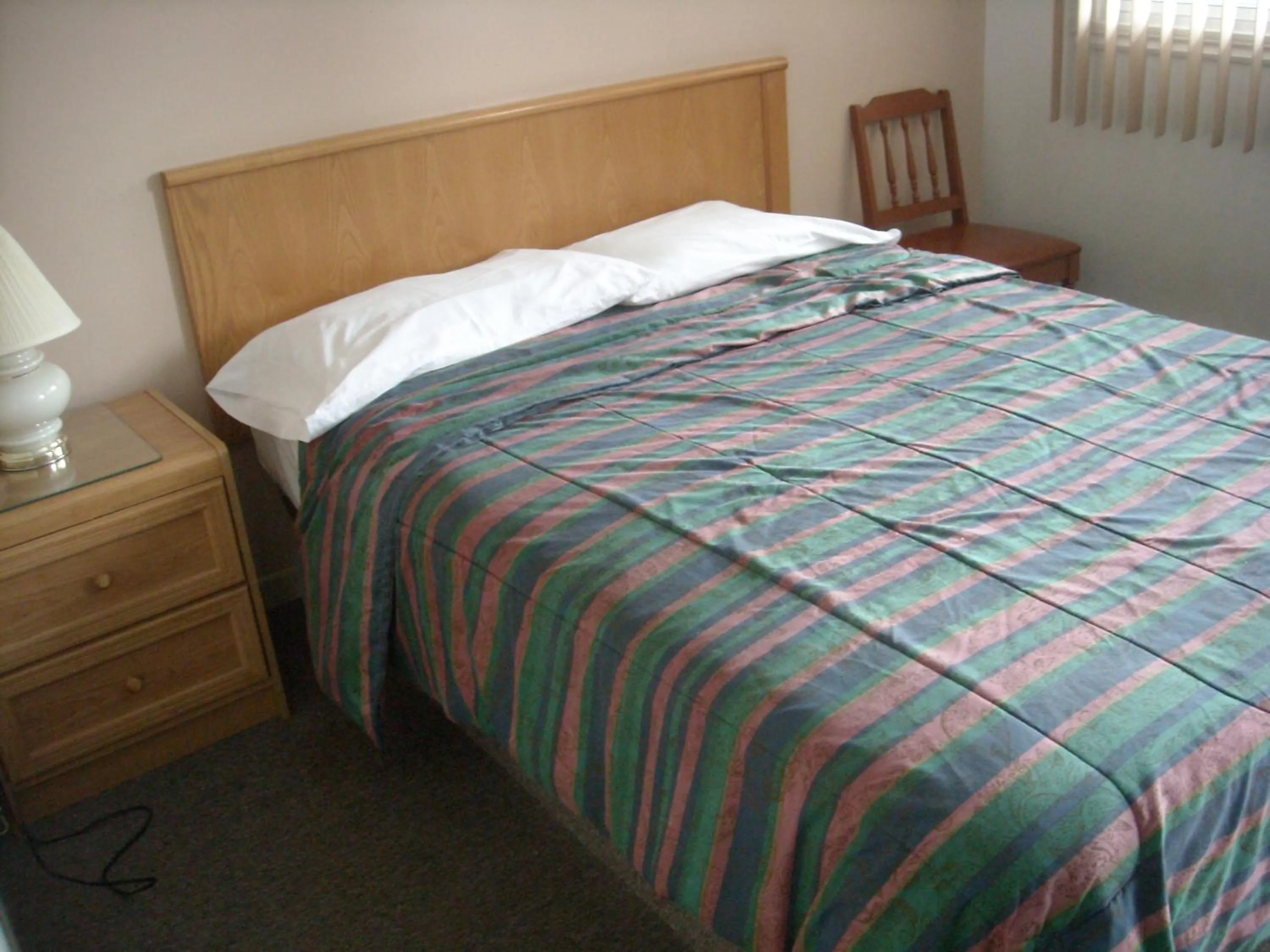 Bed in Motel le Verseau