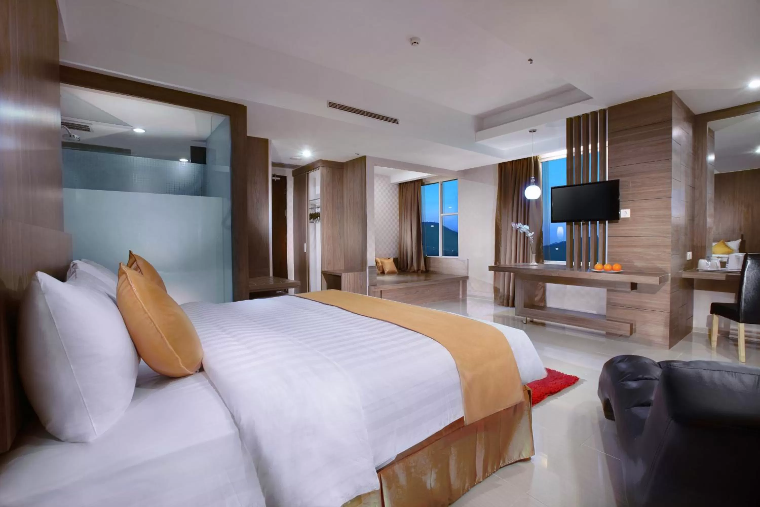 Seating area, Bed in Aston Lampung City Hotel