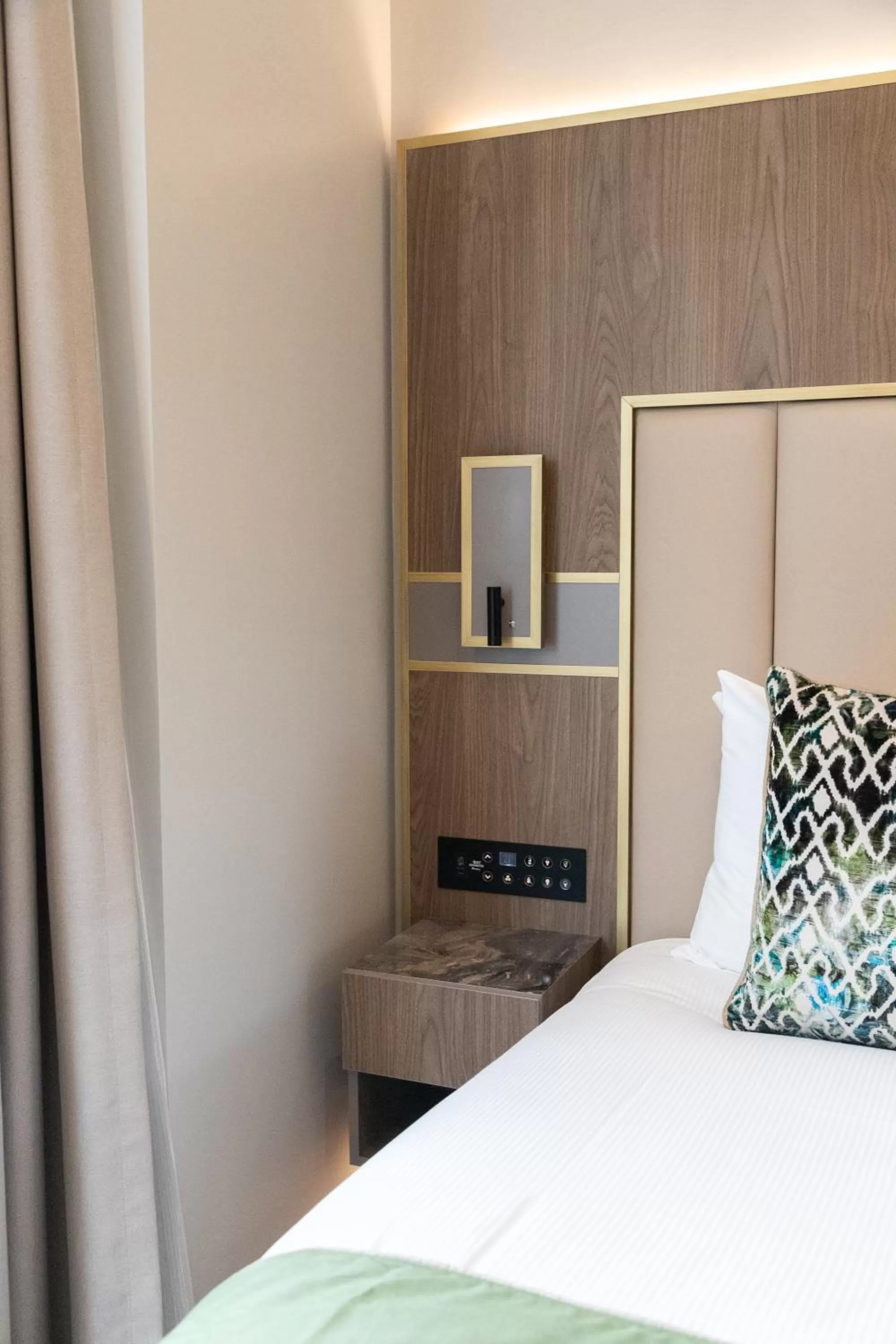 Bed in Merit Kensington Hotel