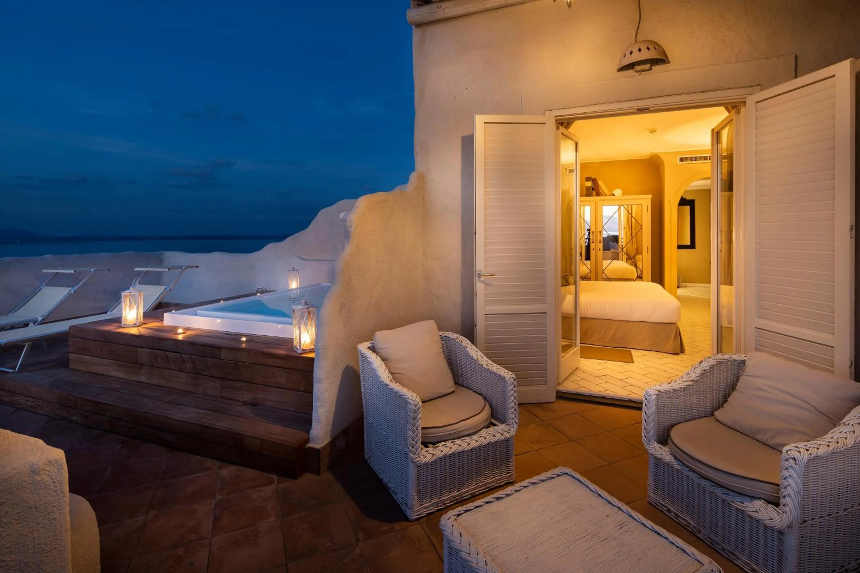 Balcony/Terrace, Bed in Therasia Resort Sea and SPA - The Leading Hotels of the World