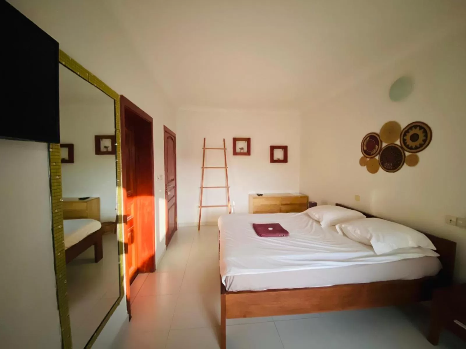 Bed in L'Oasis Guesthouse