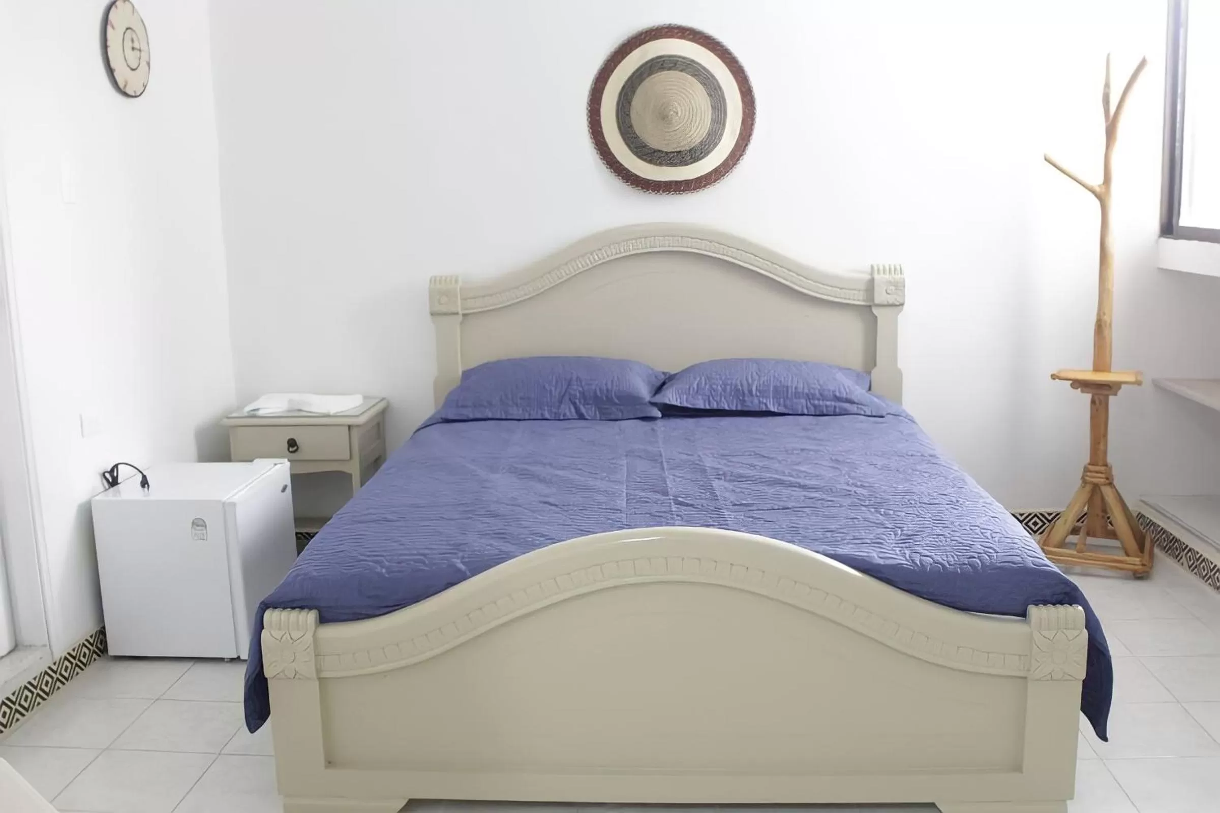 Bed in Hotel Iraka Zenu