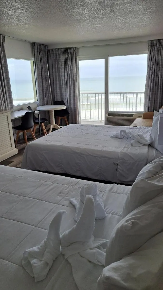 View (from property/room), Bed in Emerald Shores Hotel - Daytona Beach