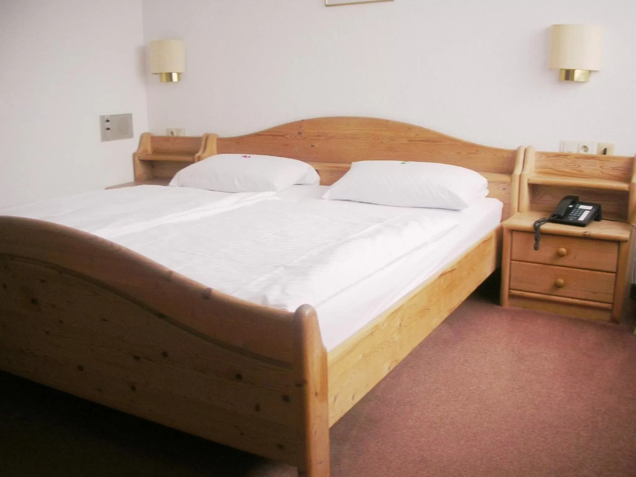 Bed in Heidehotel Hildfeld