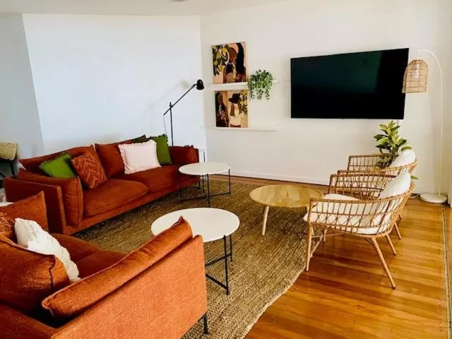 Communal lounge/ TV room in BeachView Apartments at Villa Paradiso