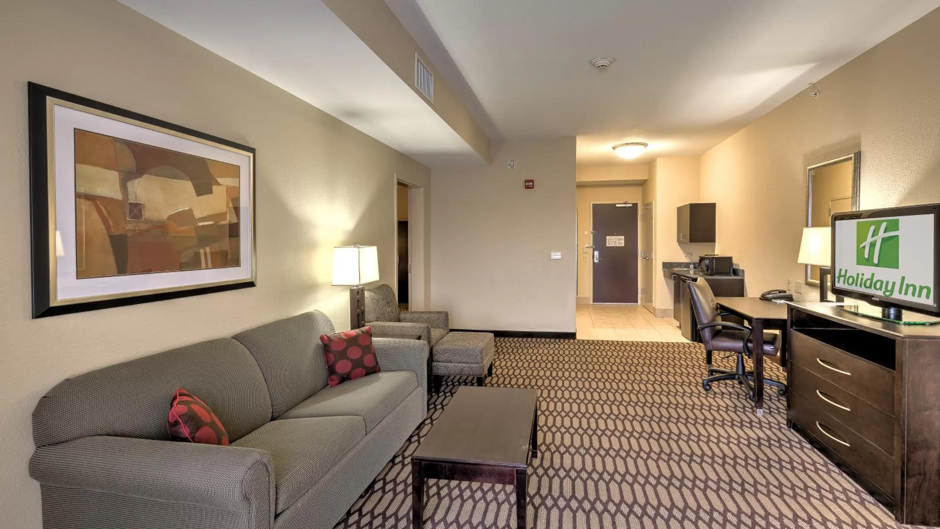 Living room in Holiday Inn North Quail Springs by IHG
