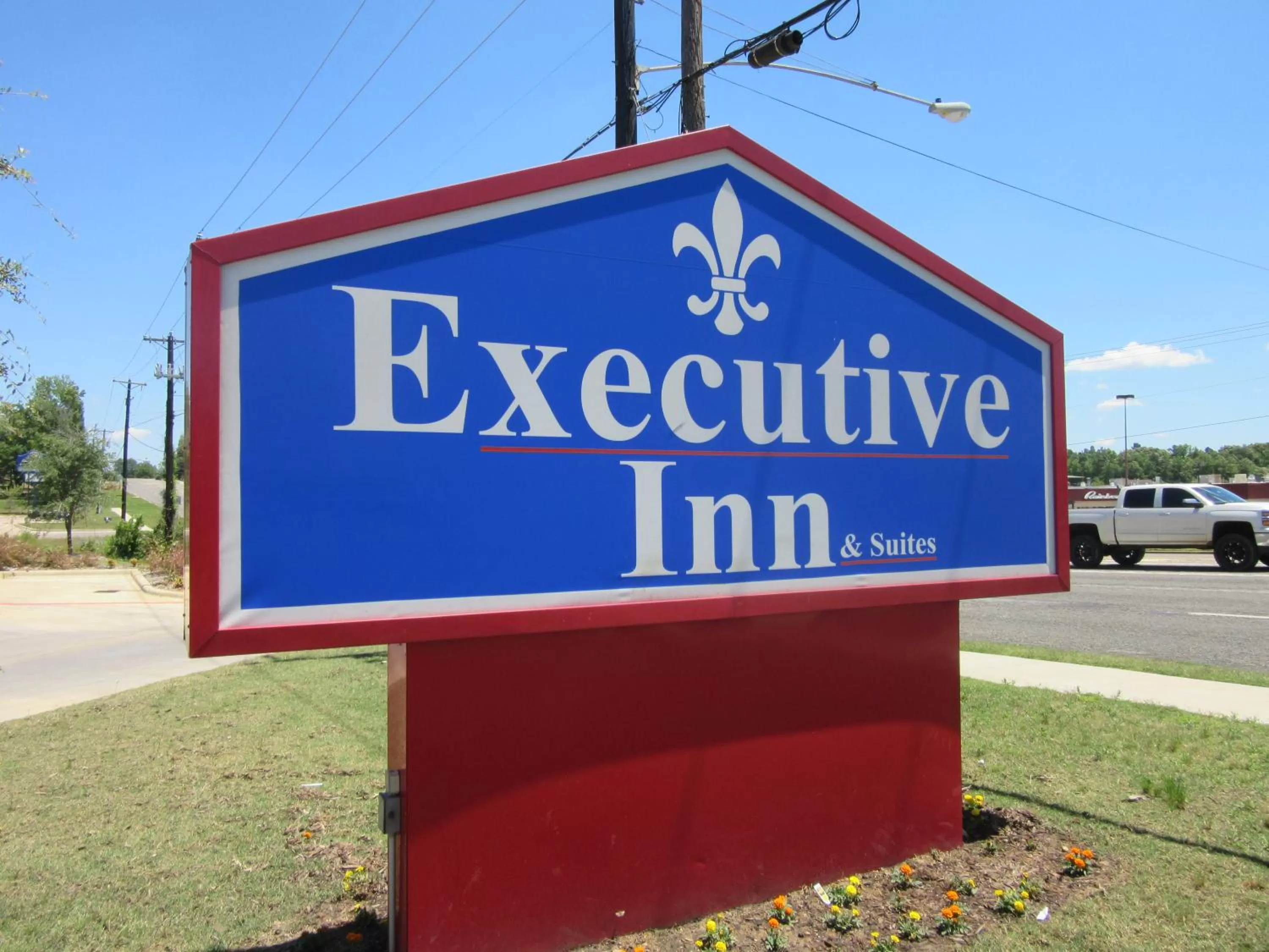 Property logo or sign in Executive Inn and Suites Tyler