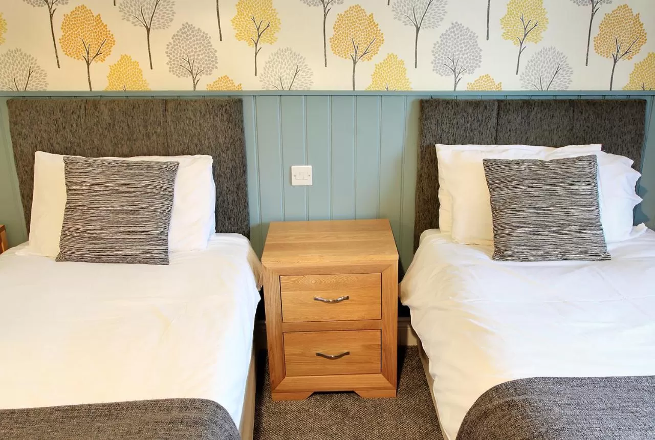 Bed in The Marine Hotel