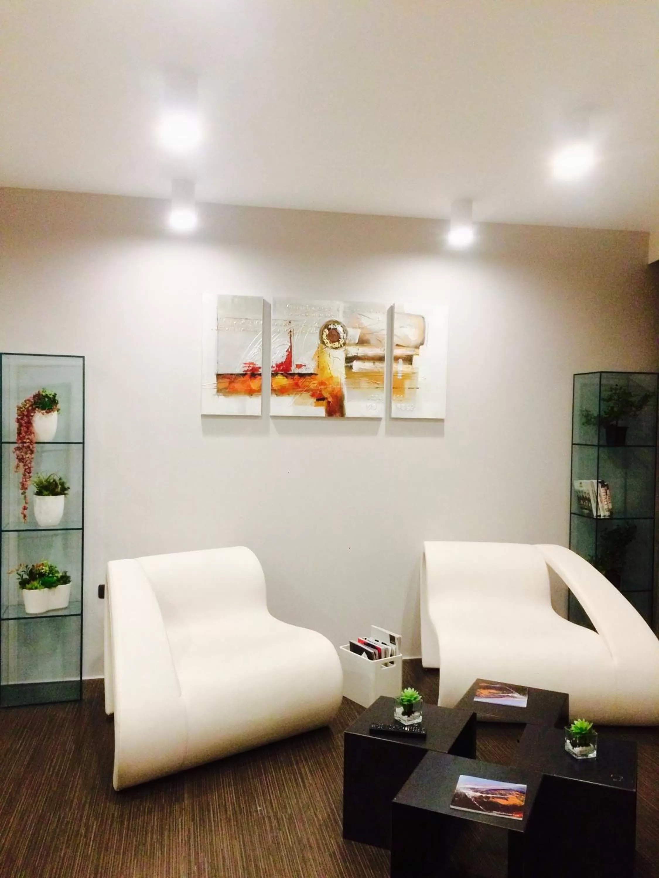 Communal lounge/ TV room in Le Camp Suite & Spa